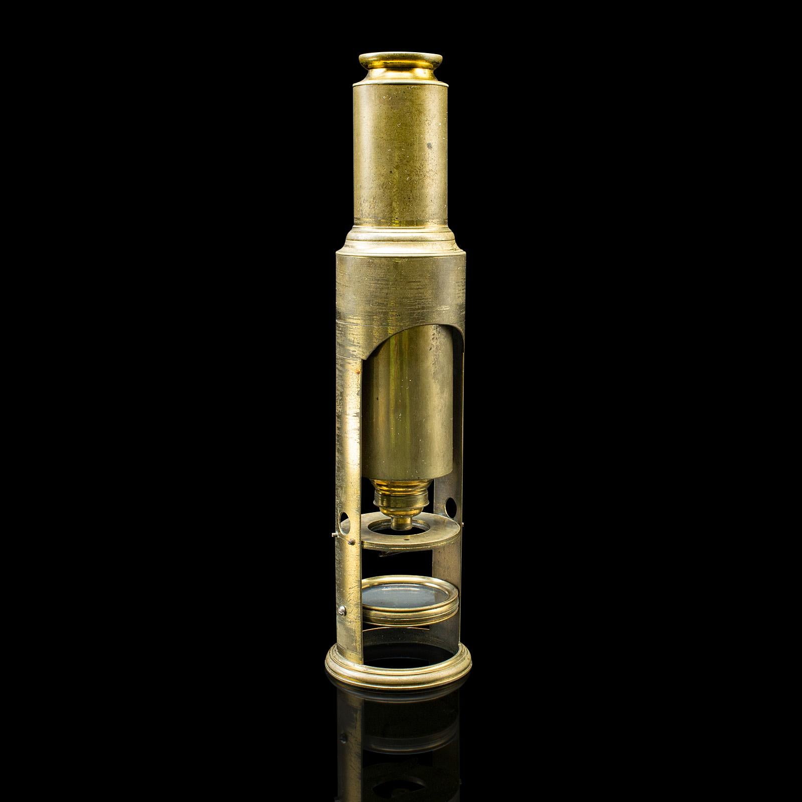 
This is an antique student's field microscope. An English, brass scientific instrument in carry case, dating to the Edwardian period, circa 1910.

Superb brass instrument with fine colour and desktop display appeal
Displays a desirable aged patina