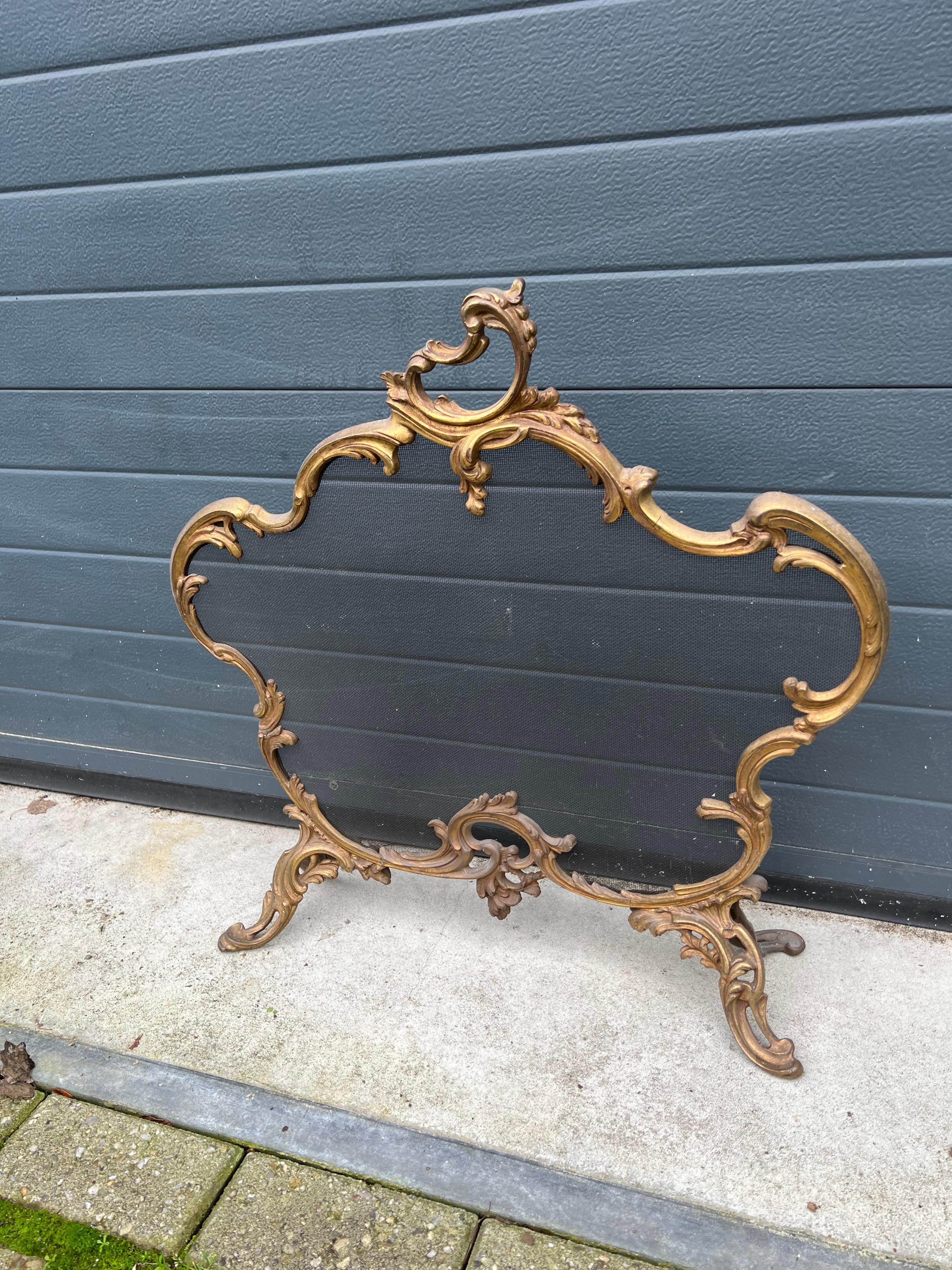 This Louis 15th Style bronze fire screen has amazing details and it is both marked and numbered.

If this beautifully handcrafted, scrolling 19th century firescreen is the right style to fit your fireplace and the size is correct for you as well