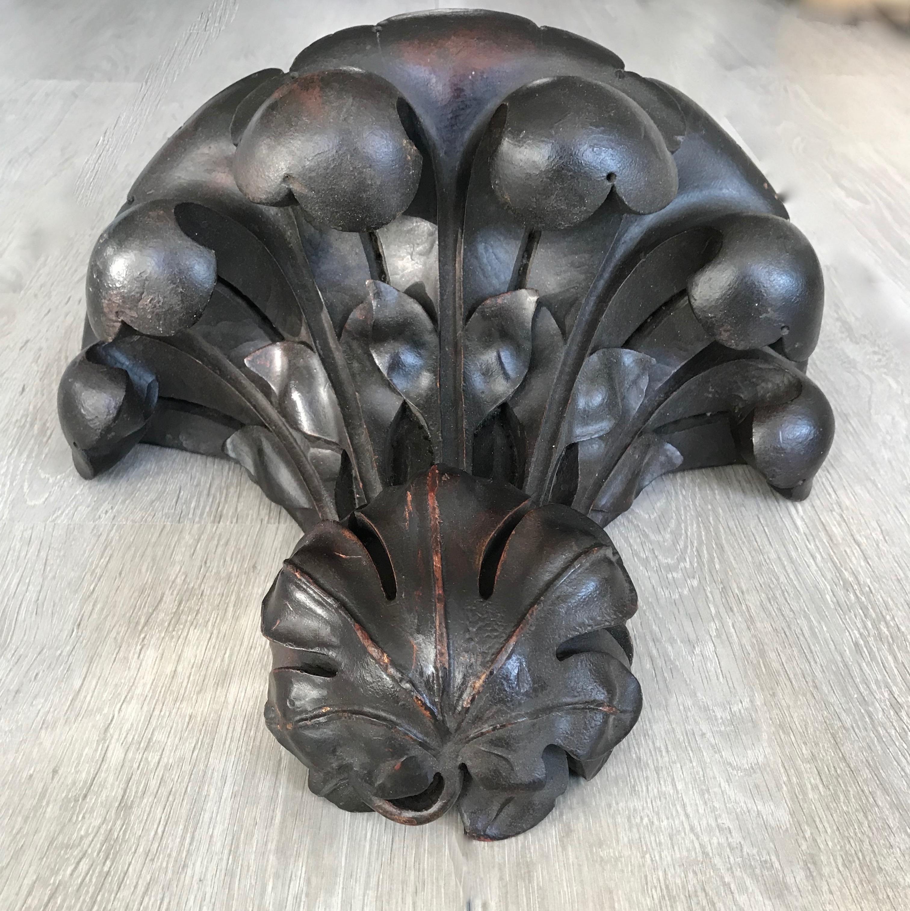 Wonderful and deeply carved Gothic Revival Bracket.

This all handcrafted, Gothic Revival wall bracket has the most wonderful shape and dark patina. The organic shape and the natural flowing lines of the deeply carved acanthus leafs are an absolute