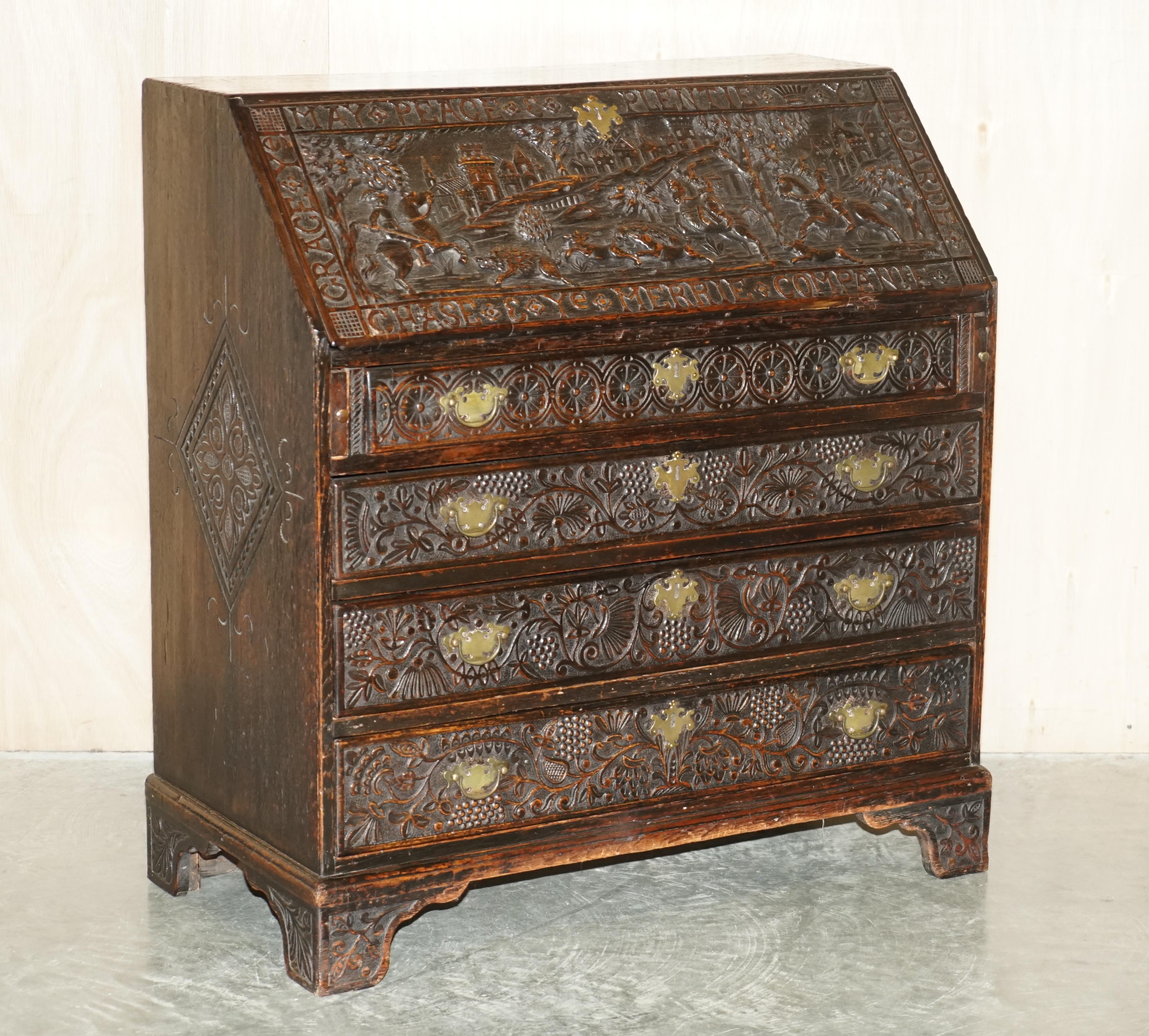 We are delighted to offer for sale this very rare and highly collectable, ornately carved, circa 1780 Jacobean revival, Antique Library Bureau 

What a piece! Hand carved from every single angle, the bureau front has very old English writing all