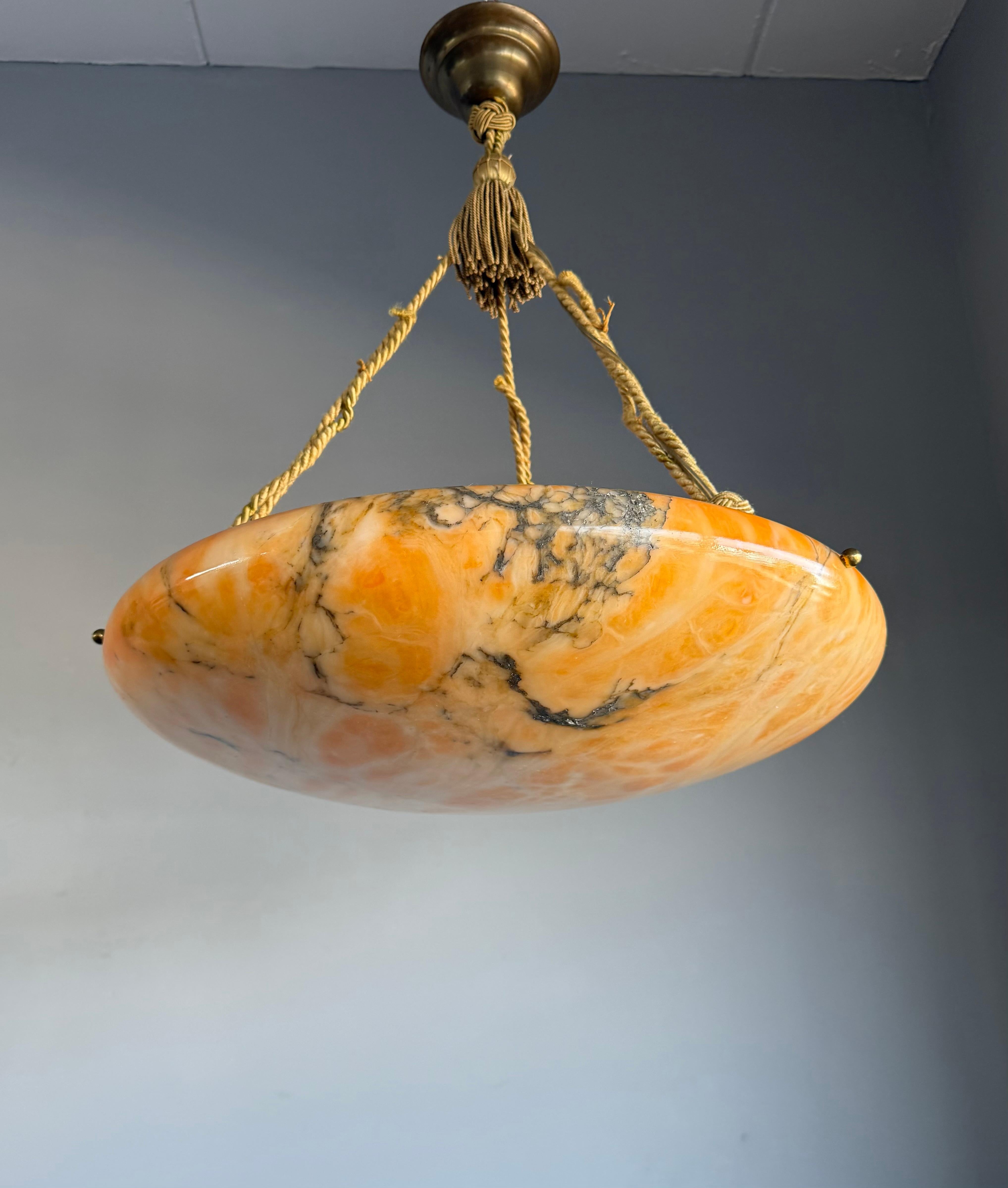 One-of-a-Kind XL Aabaster pendant light with stunning Veins.

Some pieces just stop you in your tracks, this extra-large amber color alabaster pendant is one of them. We’ve seen a lot of antique lights over the years, but the veining on this one?