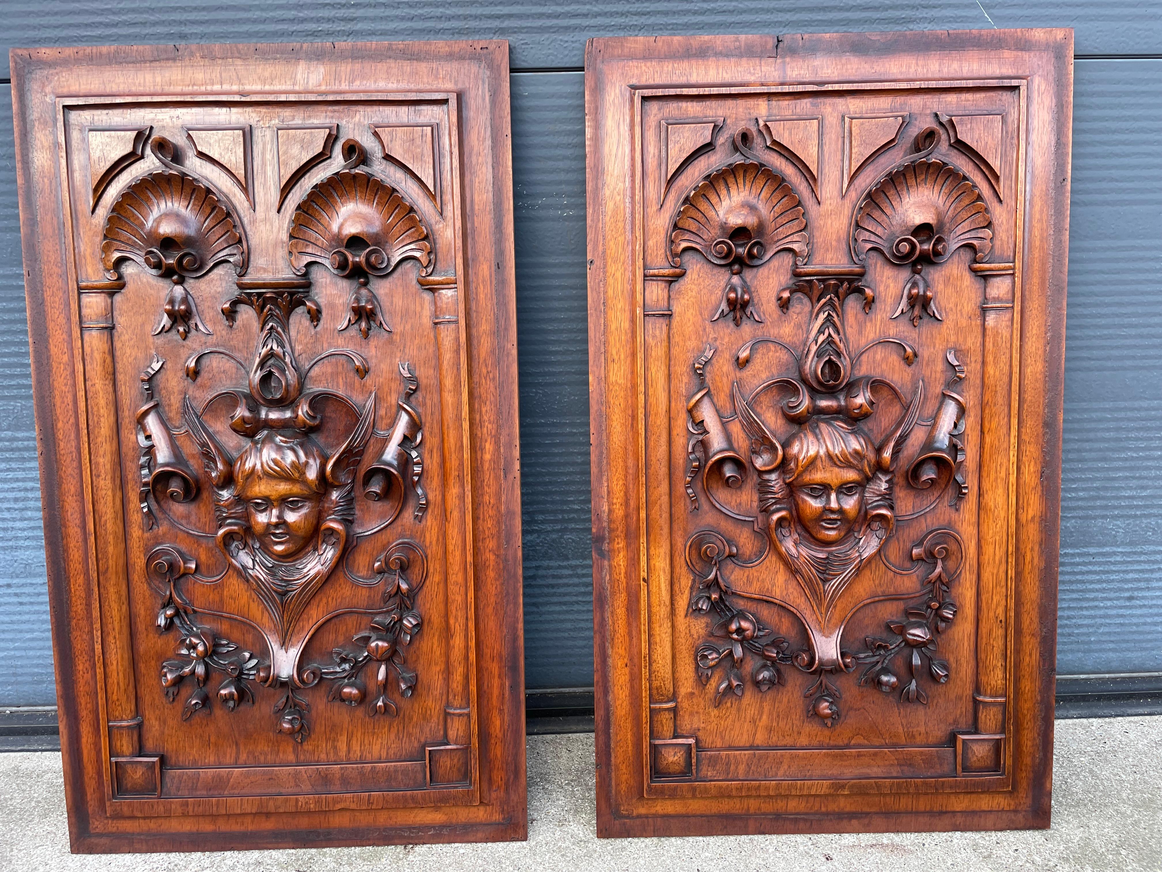 Museum quality and superb condition angel wall panels in deep carved relief.

This striking pair of hand carved panels is right up there with the best we have ever seen. First of all, because of the superb quality and depth of the multiple and