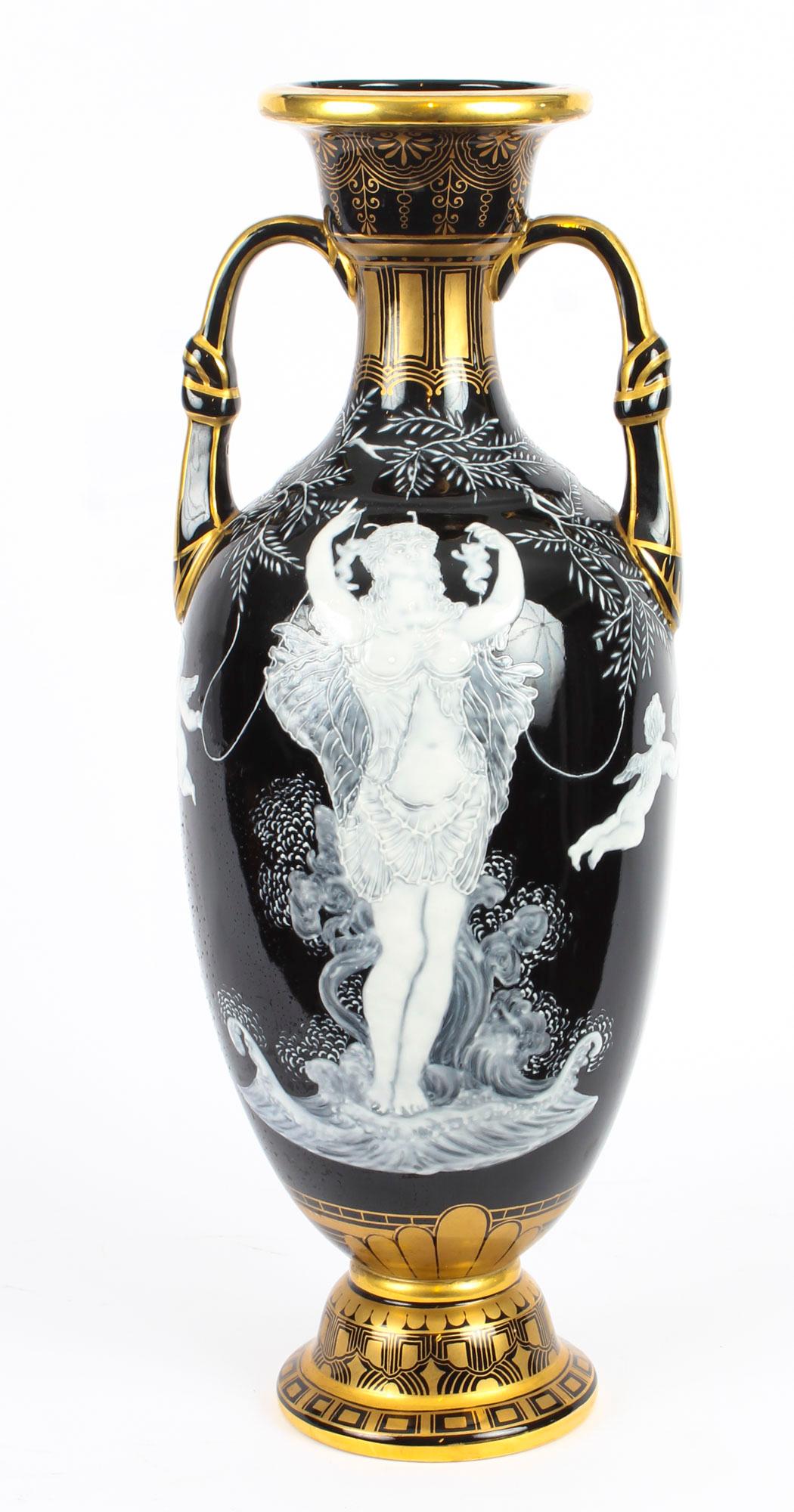 A magnificent pair of Sèvres 'pate-sur-pate' twin handled vases circa 1880 in date.
 
The loutrophoros shaped vases each worked with scantily clad maidens interspersed with winged putti amongst foliate sprays, the neck handles and foot feature