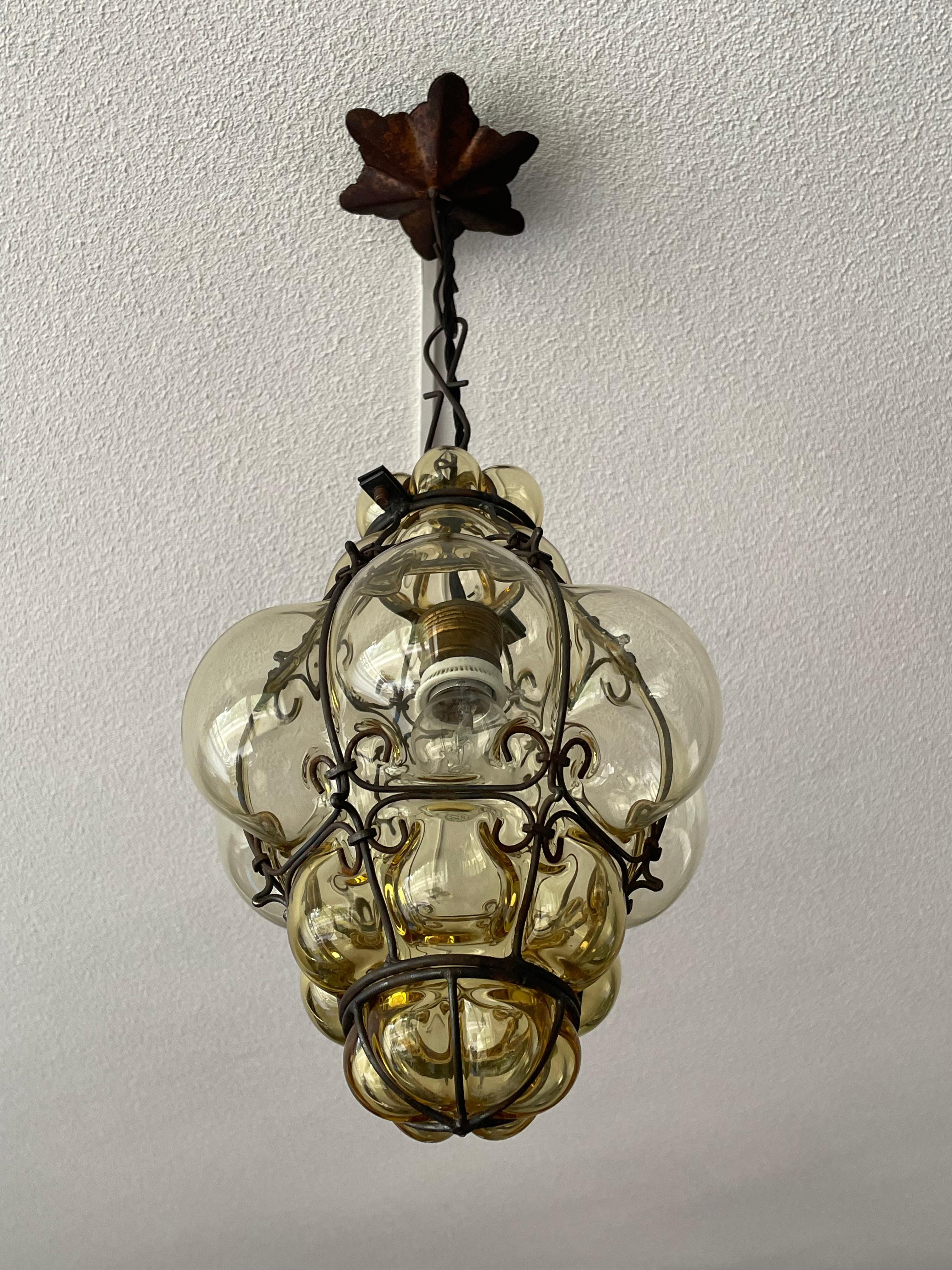 Arts and Crafts Antique & Stunning Venetian Murano Pendant Mouth Blown Amber Glass in Iron Frame