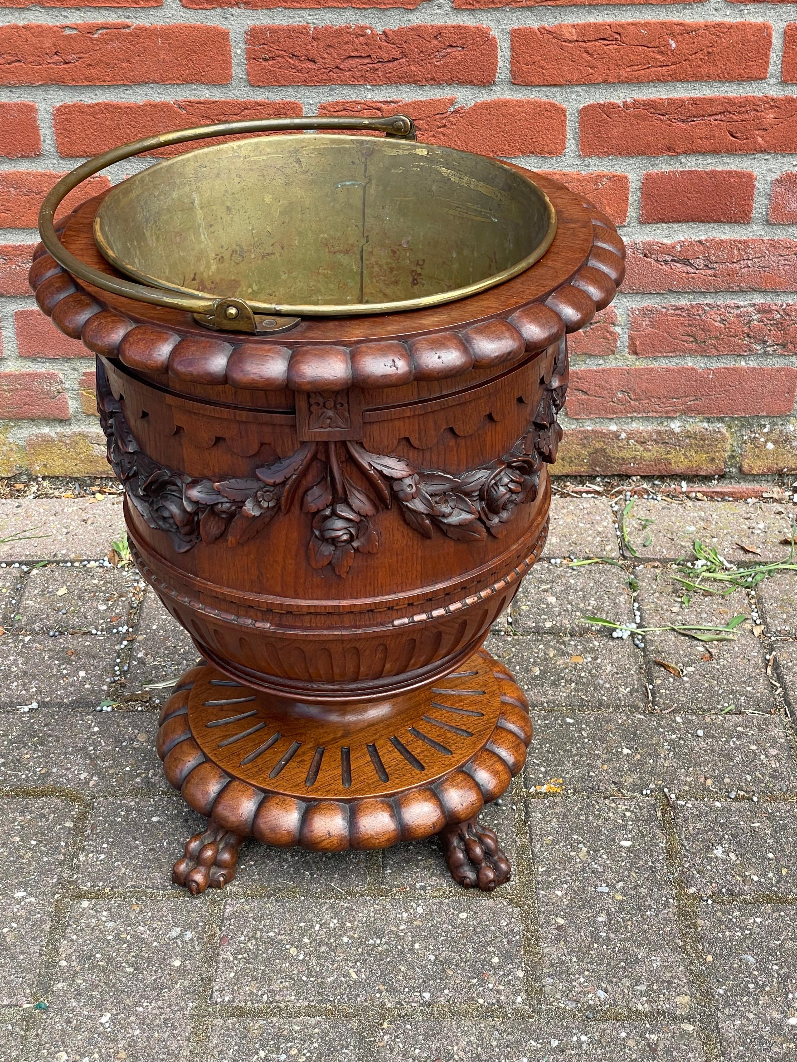 Very stylish and incredible workmanship, late 1800s 'tea-bucket' on claw feet.

For a stylish, beautiful and practical antique like this there is always room in your home. Like you may already know, we have been selling antiques for over 30 years