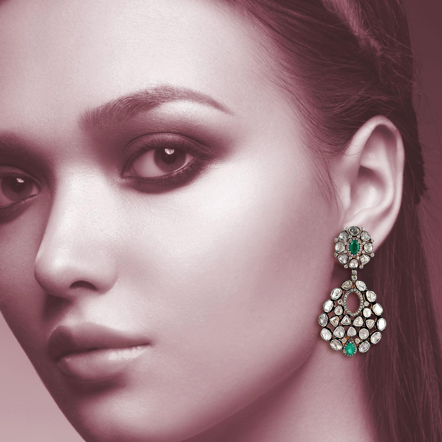Inspired by the Mughal Era & Royal heritage these stunning earrings are handcrafted in 14-karat gold & sterling silver.  They have a chandelier-style silhouette that's encrusted with 1.52 carats emeralds and 11.8 carats rose cut diamonds with