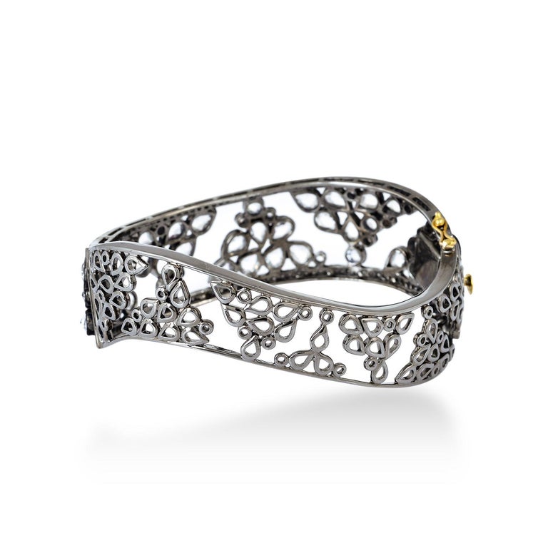 A beautiful bracelet handmade in 18K gold & sterling silver. It is set in 12.86 carats of sapphire in blackened finish. 

FOLLOW  MEGHNA JEWELS storefront to view the latest collection & exclusive pieces.  Meghna Jewels is proudly rated as a Top
