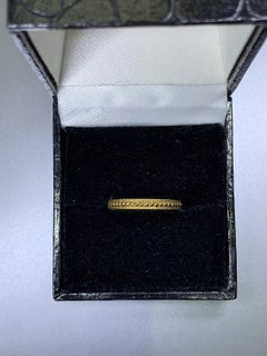 Antique style 18k yellow gold wedding band.