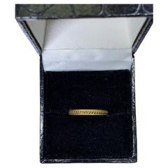 Used style 18k yellow gold wedding band.