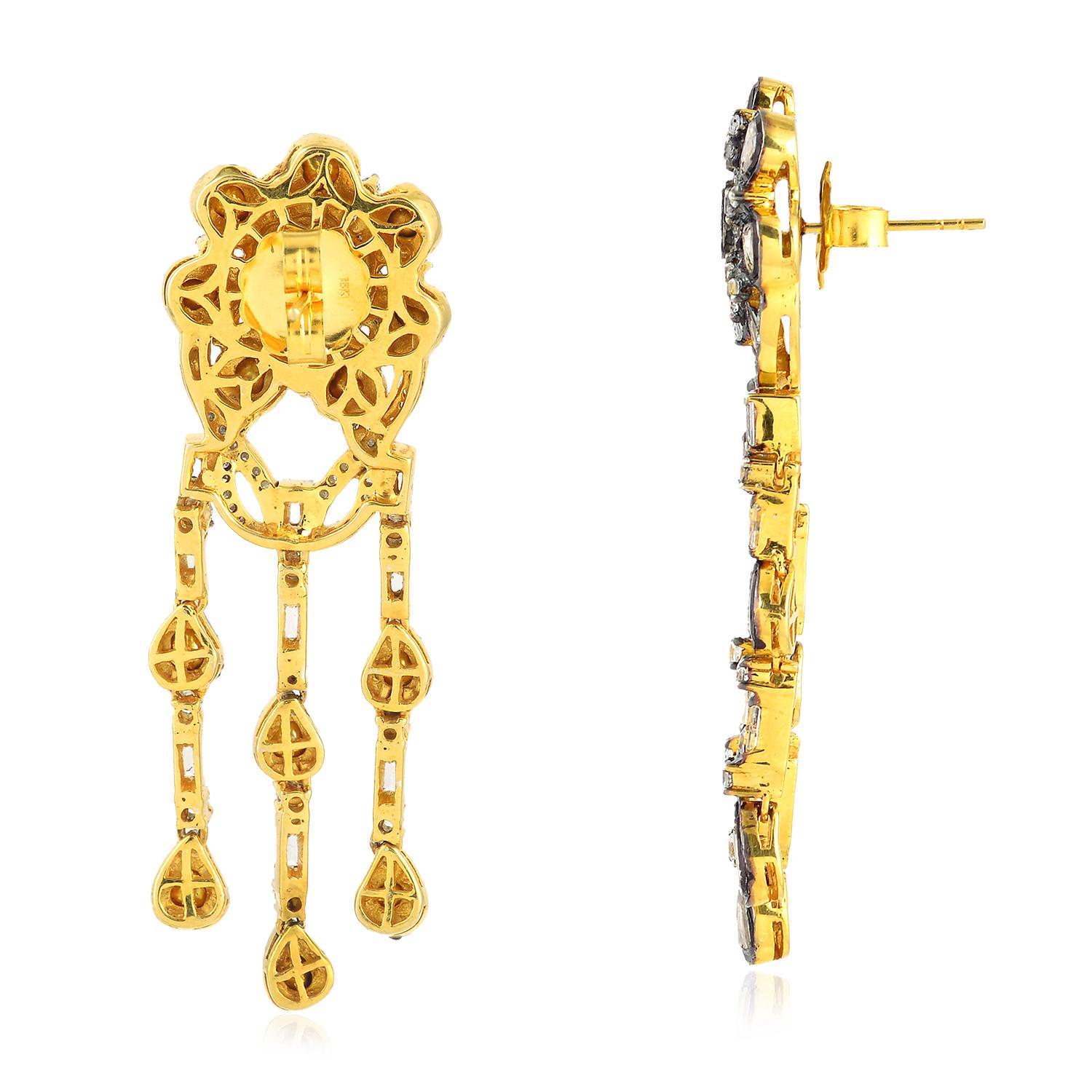 Inspired by the Mughal Era & Royal heritage these stunning earrings are handcrafted with 18-karat gold & sterling silver.  They have a chandelier-style silhouette that's encrusted with 3.41 carats topaz and 4.5 carats rose cut diamonds with