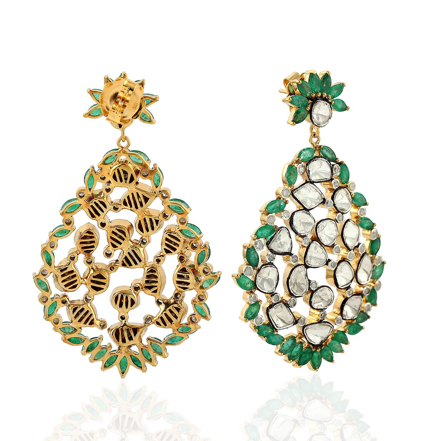 Inspired by the Mughal Era & Royal heritage these stunning earrings are handcrafted in 18-karat gold & sterling silver.  They have a chandelier-style silhouette that's encrusted with 8.17 carats emeralds and 9.56 carats rose cut diamonds with