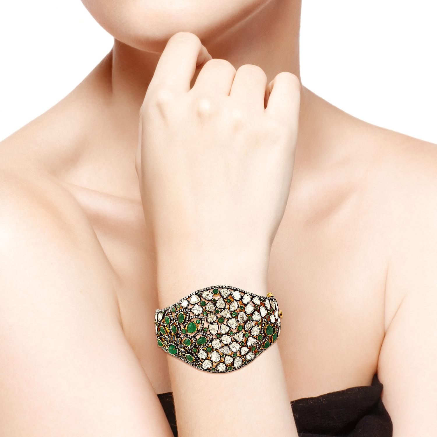 A stunning bracelet handmade in 18K gold & sterling silver with blackened finish. It is set in 8.23 carats emerald, 1.07 carats spinel & 14.1 carats rosecut diamonds. Clasp Closure. Instock

FOLLOW  MEGHNA JEWELS storefront to view the latest