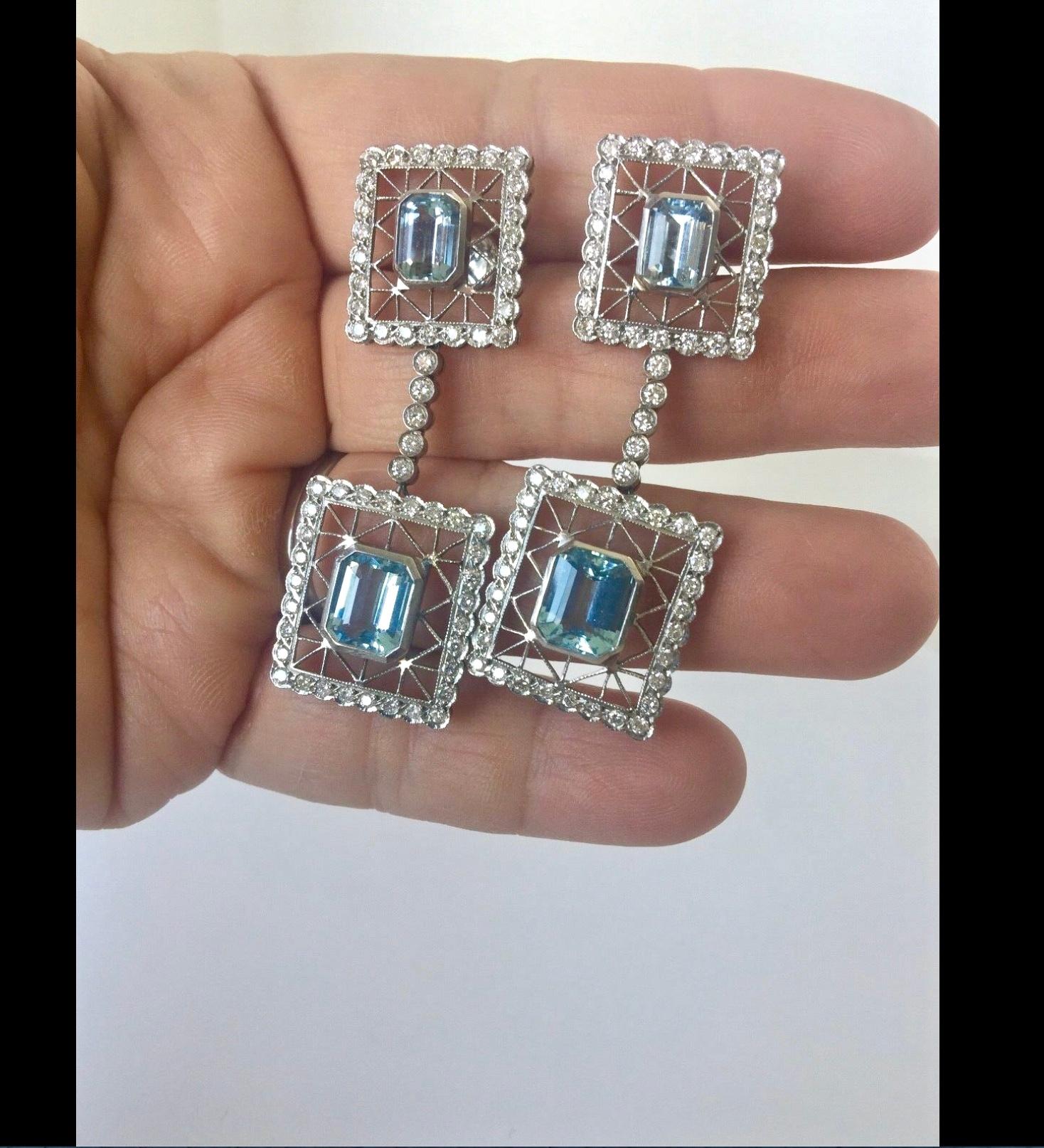 Reminiscent of the Deco era, these radiant drop Aquamarine Diamonds earrings have elegant Aquamarine emerald cut stones detailed with diamonds and crafted in 18K white gold.
Pure sparkle!! 10 carat four bright emerald cut Aquas -fall in line to
