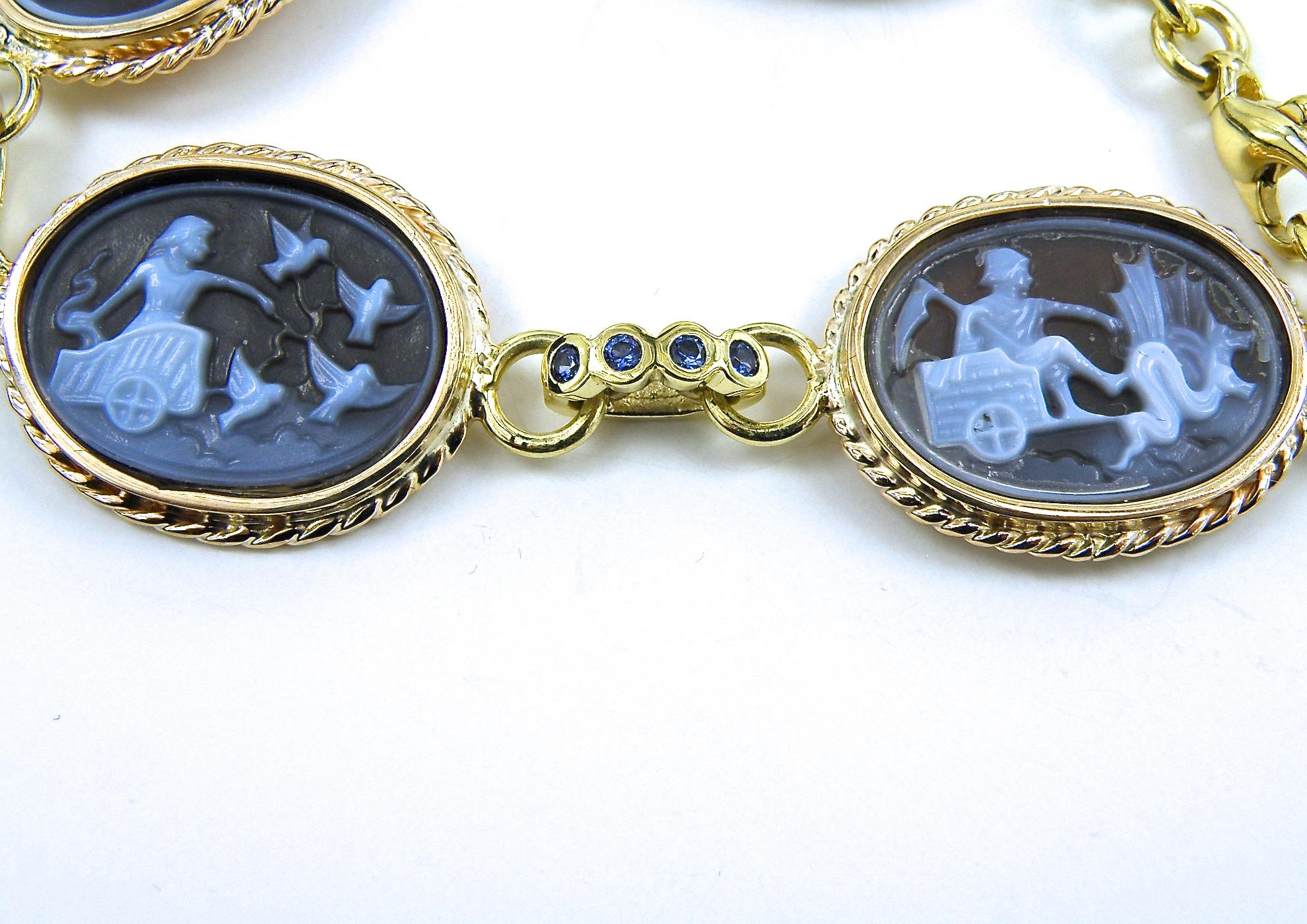 12x15 carved  agate ancient scenes, each individually styled.
Beautiful bezelled sapphire connectors.