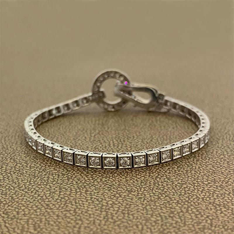 A lovely diamond bracelet featuring 2.70 carats of VS quality round brilliant cut diamonds. The settings of each stone is finished with milgrain work typical of antique jewelry. Made in 18K white gold and finished with a safety clasp and a secure