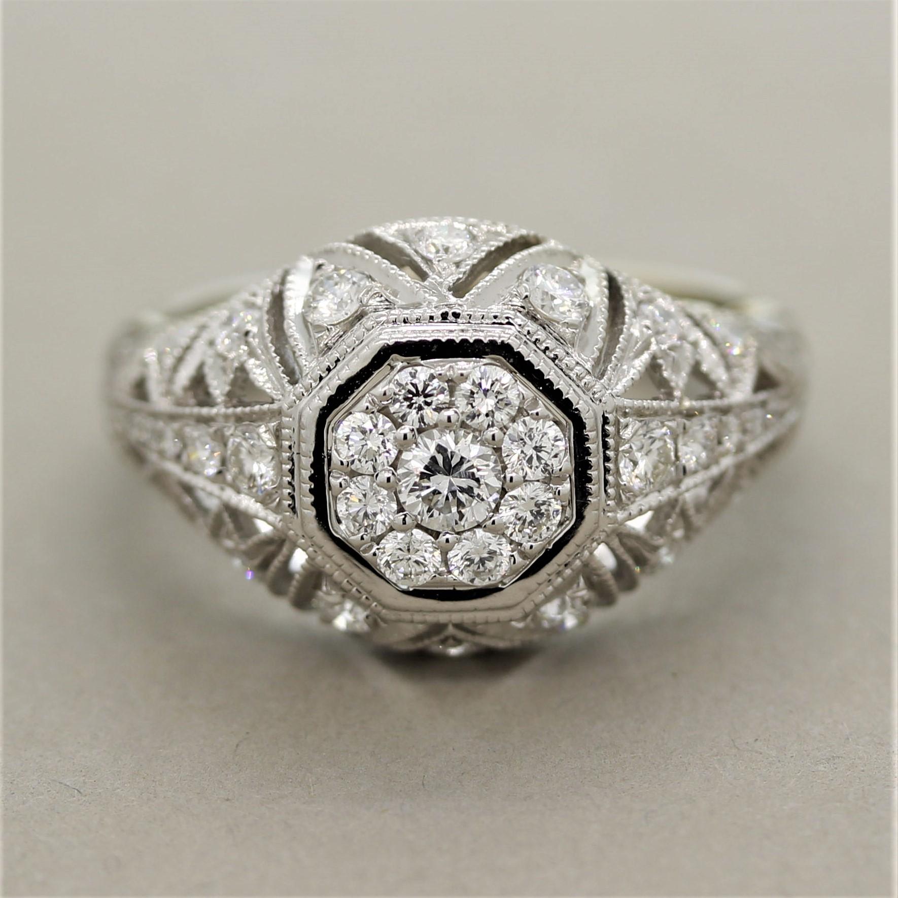 A brand new ring made in the antique Art Deco style! It features 0.75 carats of round brilliant cut diamonds set around the ring. It has classic examples of the Art Deco style which include the milgrain finish around the diamond settings as well as