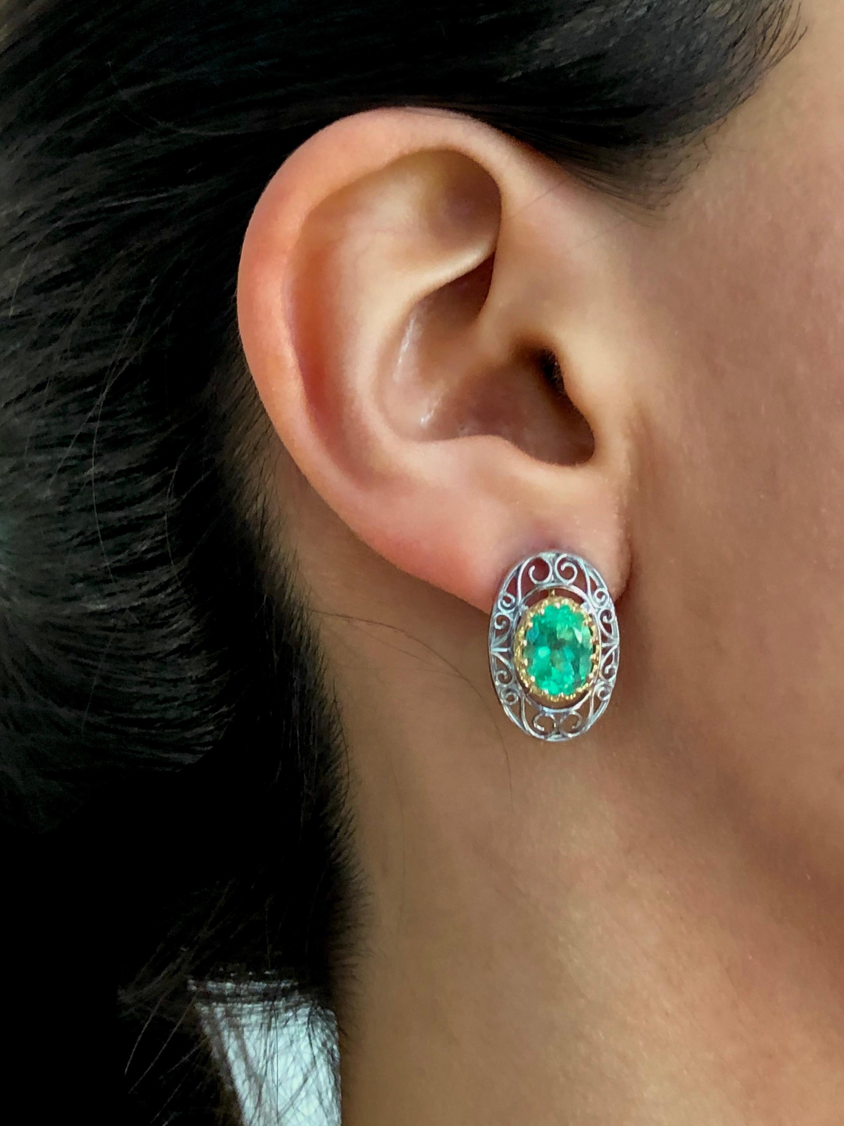 This pair of classic antique-Inspired scroll style earrings 18K yellow gold and platinum earrings is set with two natural Colombian emeralds 4.0 carats (each 2.00ct) framed by crown bezel 18K gold.
Measure 20.5 x 13.5 mm
Total length with ear wire