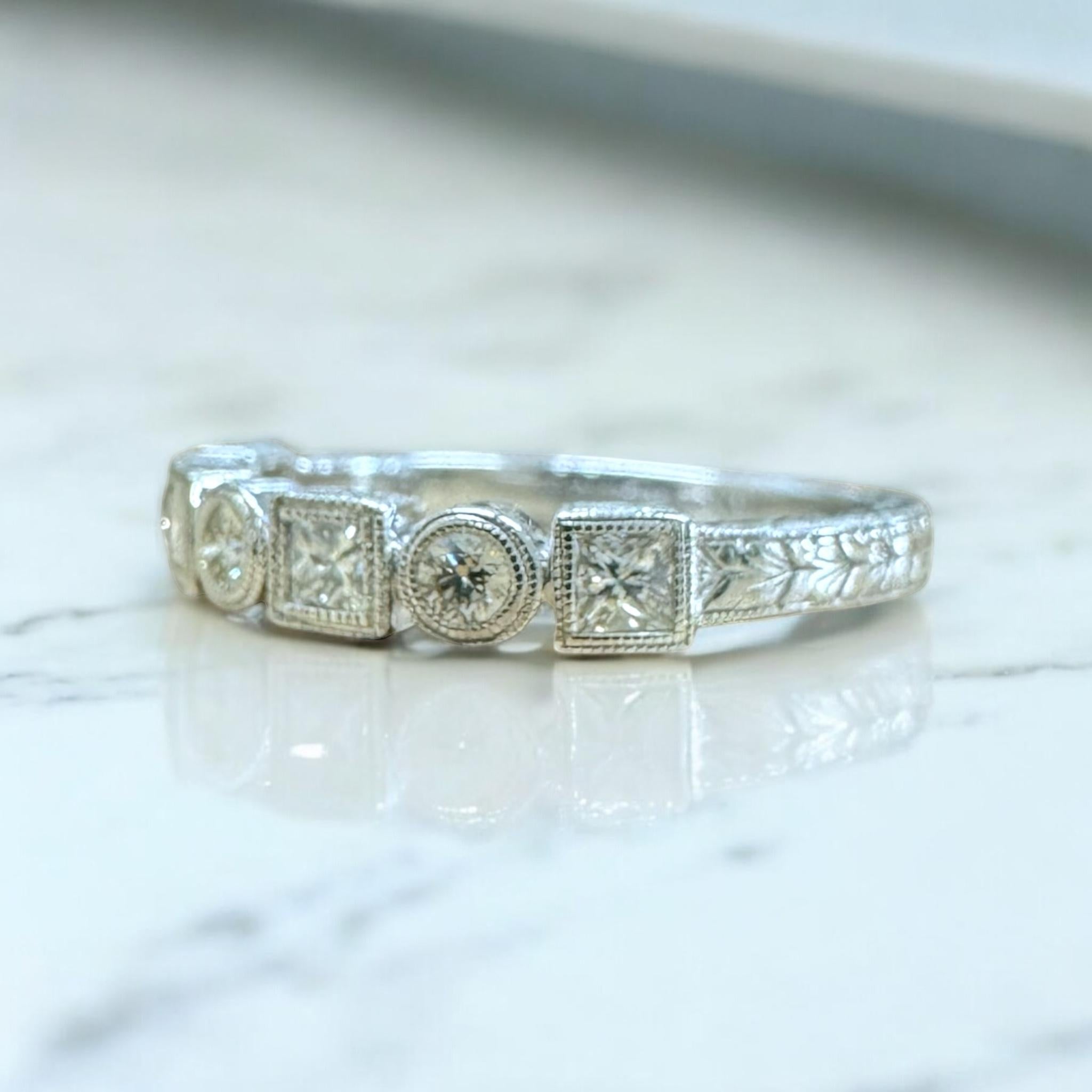 We always love these dainty engraved diamond bands!!

Band Details
Material: 14K White Gold
Width: 3.2mm
Weight: 2.5 Grams
Finger Size: 6 3/4
Sizable Upon Request

Accented by the following gemstones
4 - 2.5mm Princess Cut Diamonds
3 - 2.4mm Round