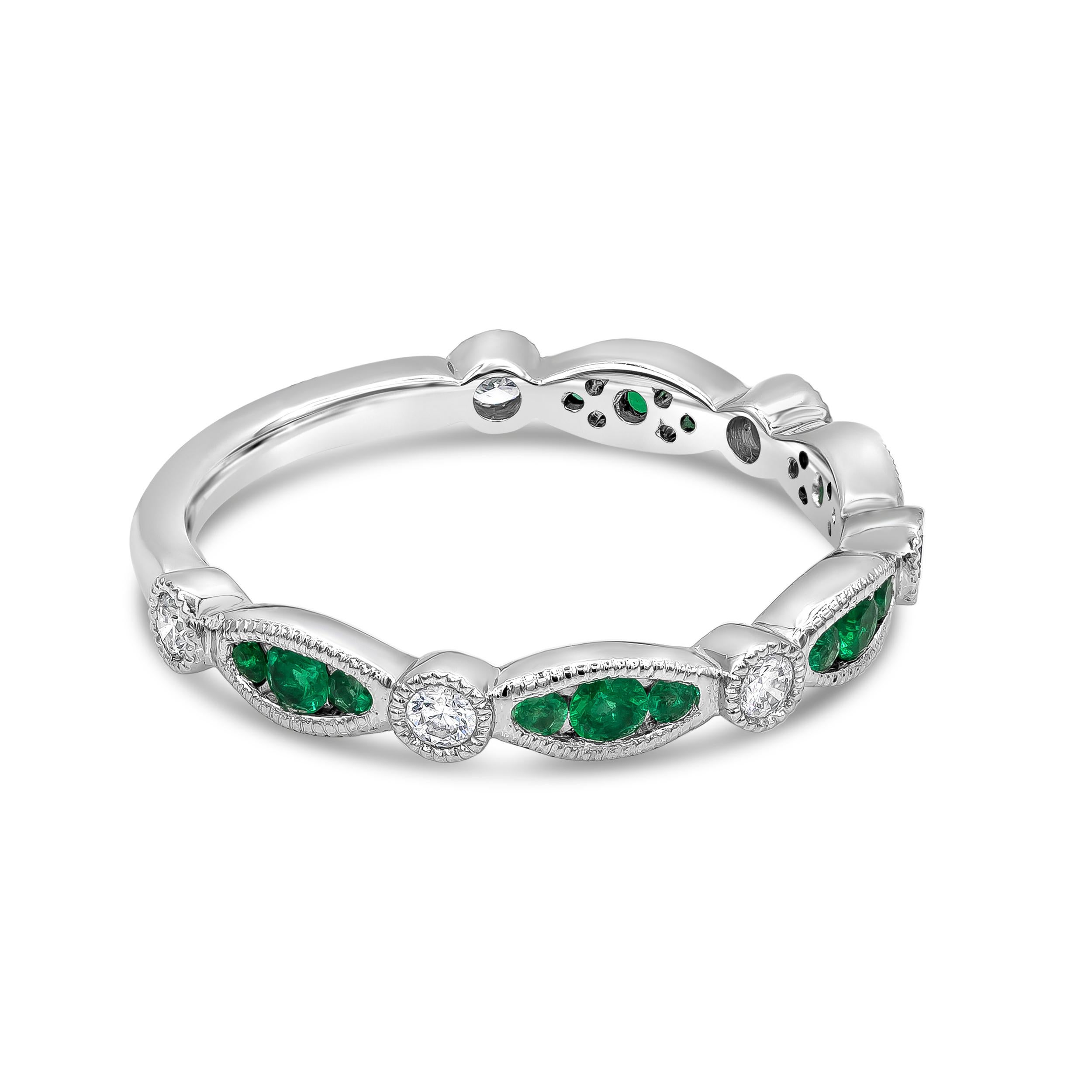 An vintage-inspired ring showcasing green emeralds weighing 0.21 carats total, set in a marquise bezel; alternated by 0.16 carats of round brilliant diamonds set in a bezel as well. Diamonds approximately F color, VS clarity. Bezel is finished with