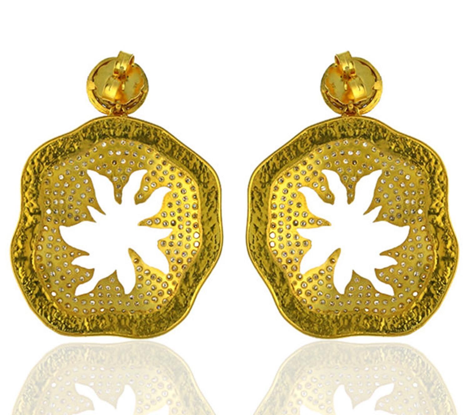 Handcrafted from 18-karat gold, these palm earrings are set with 3.63 carats of glimmering diamonds. The hammered gold is contrasted beautifully with blackened finish.

FOLLOW  MEGHNA JEWELS storefront to view the latest collection & exclusive