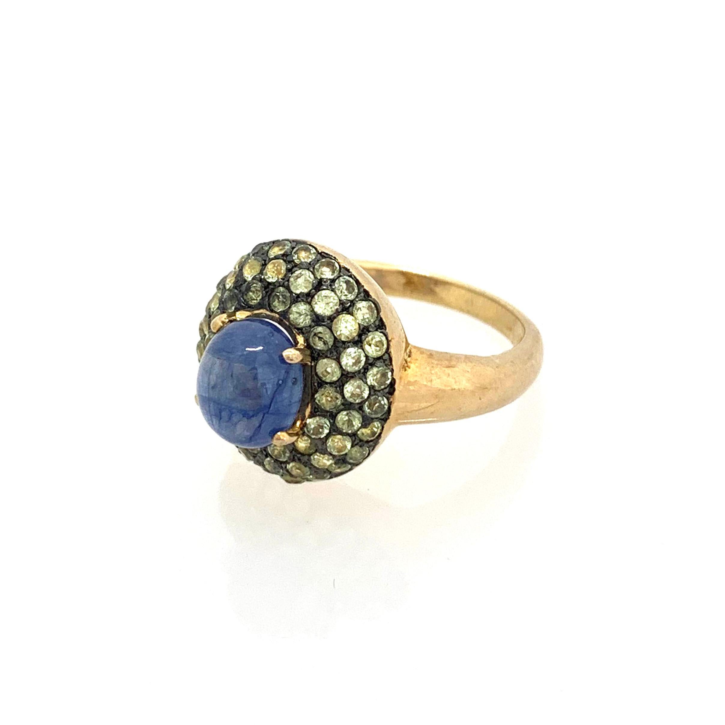 Antique-style Oval Sapphire and White Peridot Cocktail Ring

This fabulous ring features a 4ct oval cabochon-cut blue sapphire surrounded with 51pcs of round peridot, handset in two-tone 18k gold vermeil and black rhodium gilded over sterling