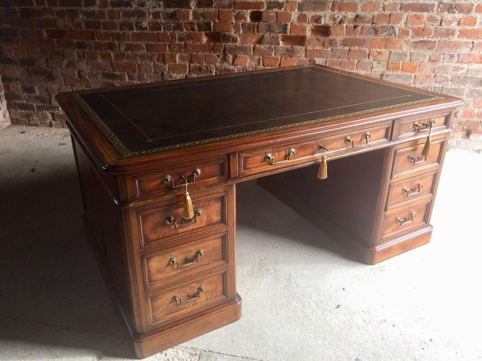 A magnificent and very impressive 20th century antique style Mahogany Partners Desk, the rectangular top with tooled green leather and gilt inset, over six frieze drawers (three to front and three to back) five of the drawers are lockable one isnt,