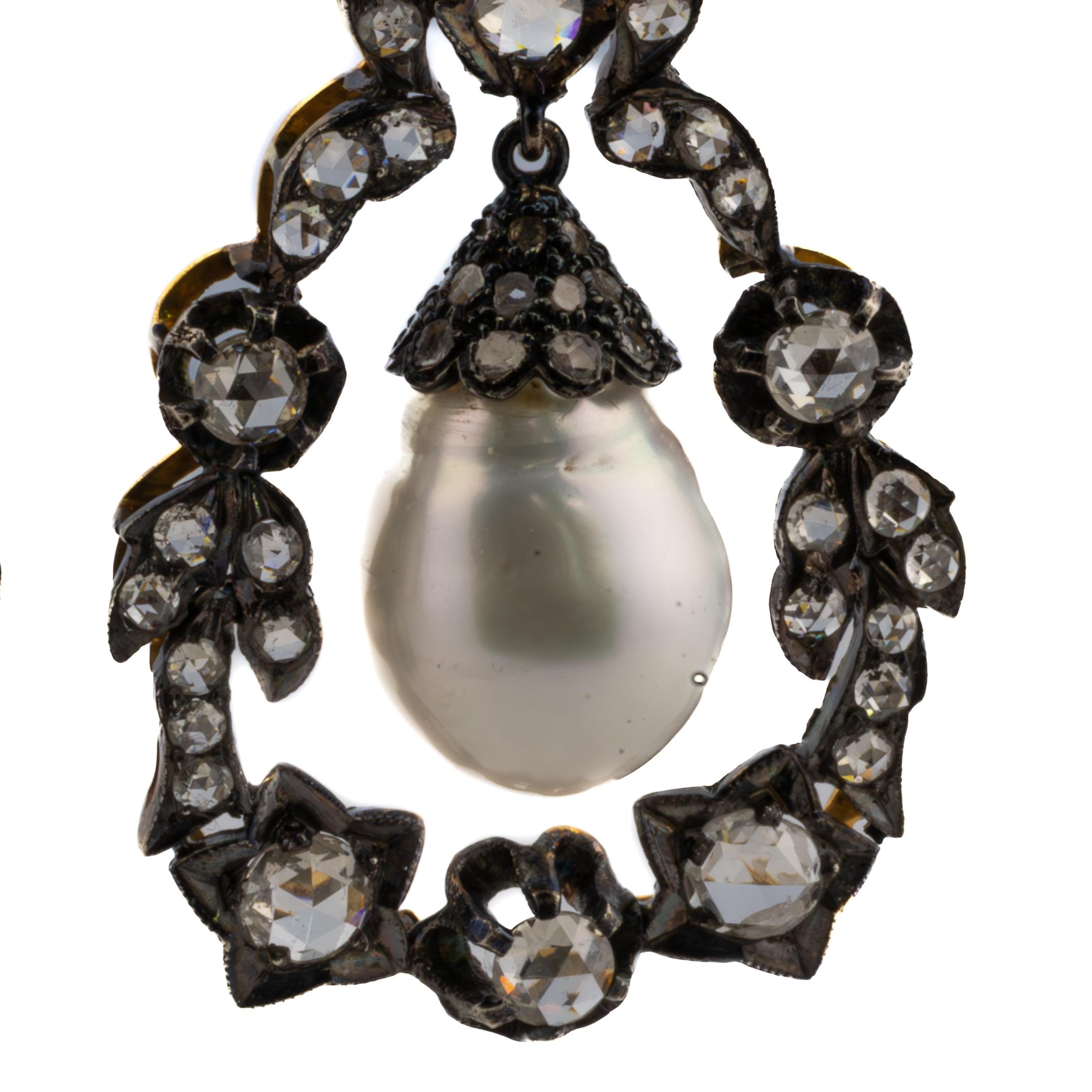 Antique-Style Pearl and Diamond Earrings

These breathtaking Pearl & Diamond Earrings are a masterful blend of sophistication and timeless beauty, crafted in 18k yellow gold and silver. Each earring features a lustrous pearl, measuring 16.8mm x 12mm