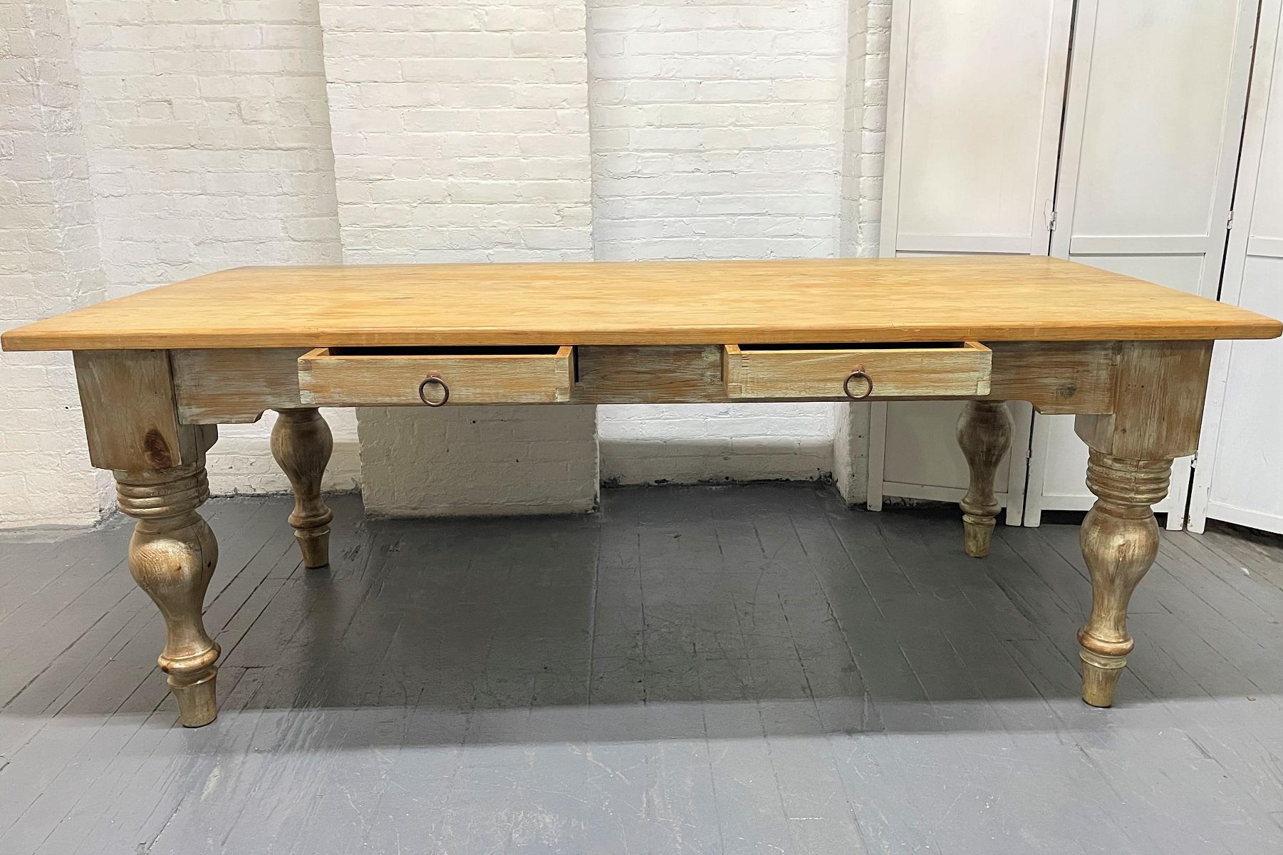 Antique Style Pine Farm Table. The table has two pull-out drawers with metal handles and a finished back. Can also be used as a large desk.