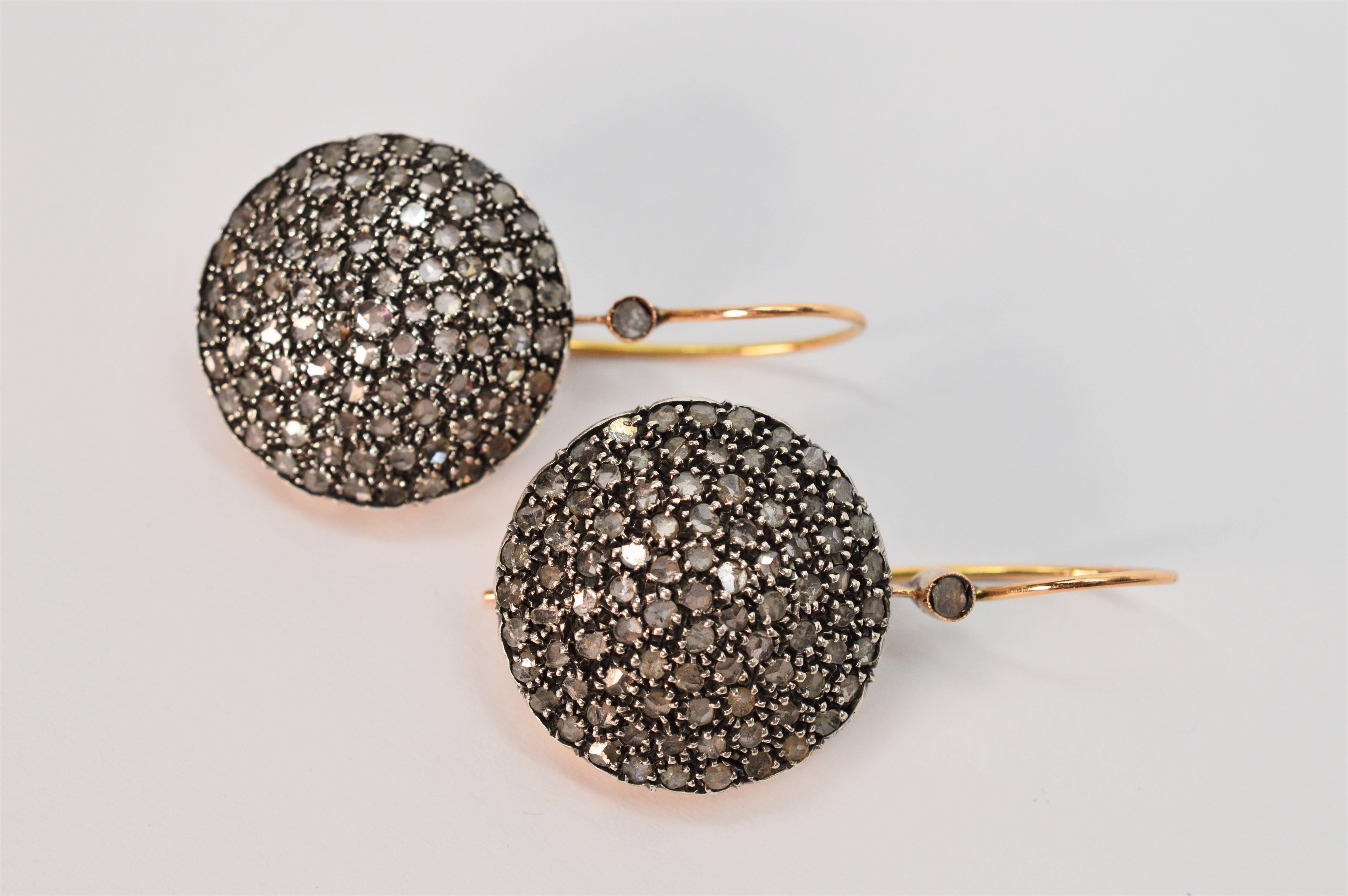 Over five carats of rose cut diamonds cover the discs of these outstanding antique style handmade drop earrings. Very unique, with one hundred seventy .03 rose cut diamonds that are expertly set in sterling silver on the hand crafted 25mm convex