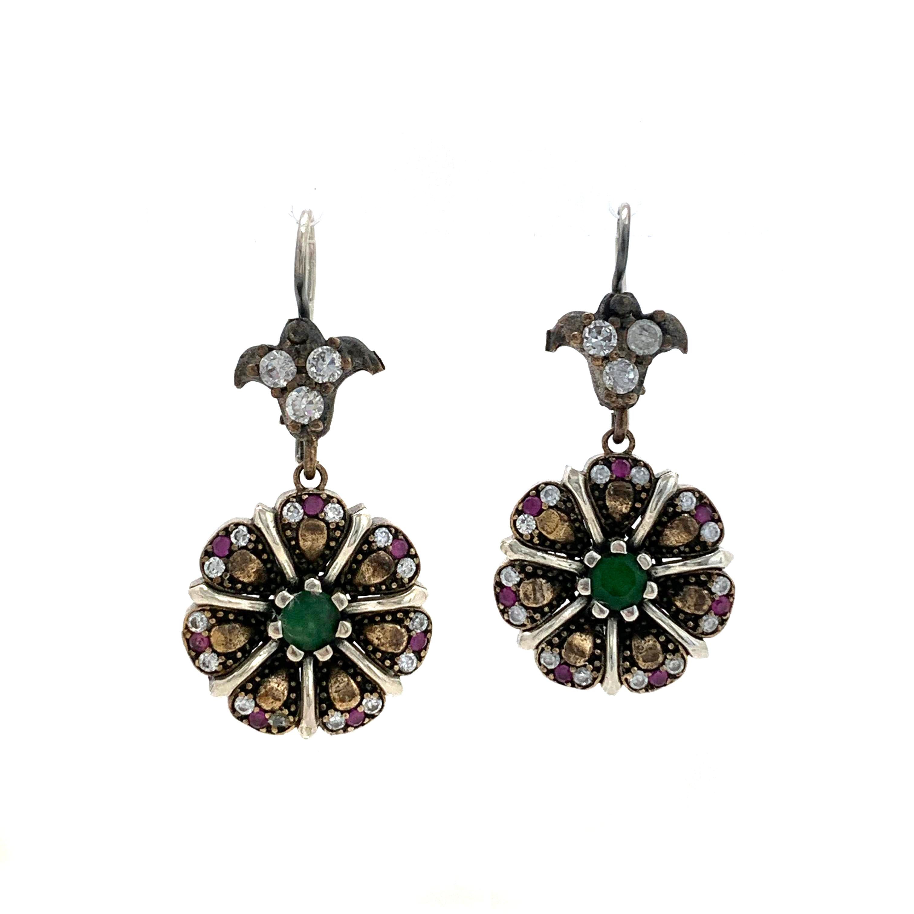 Antique Style Sterling Silver Emerald Ruby and CZ Flower Drop Earrings. The earrings features mixture of round emerald, rubies and cubic zirconia adorned in antique style - vintage gunmetal and rose gold plated over sterling silver. Handmade ear
