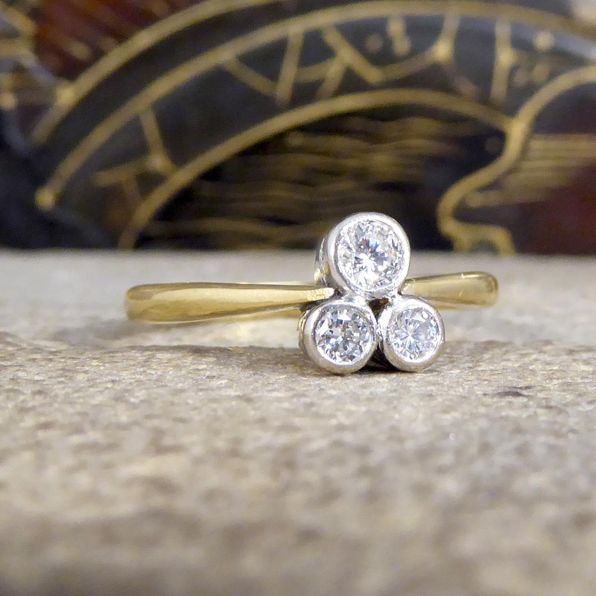 A beautiful ring that has been crafted in 2002 but designed to resemble an Edwardian style. Three collar set Diamonds sit in a triangle form to create a three leaf clover without the stem, such a simple and stunning design. The perfect gift that can