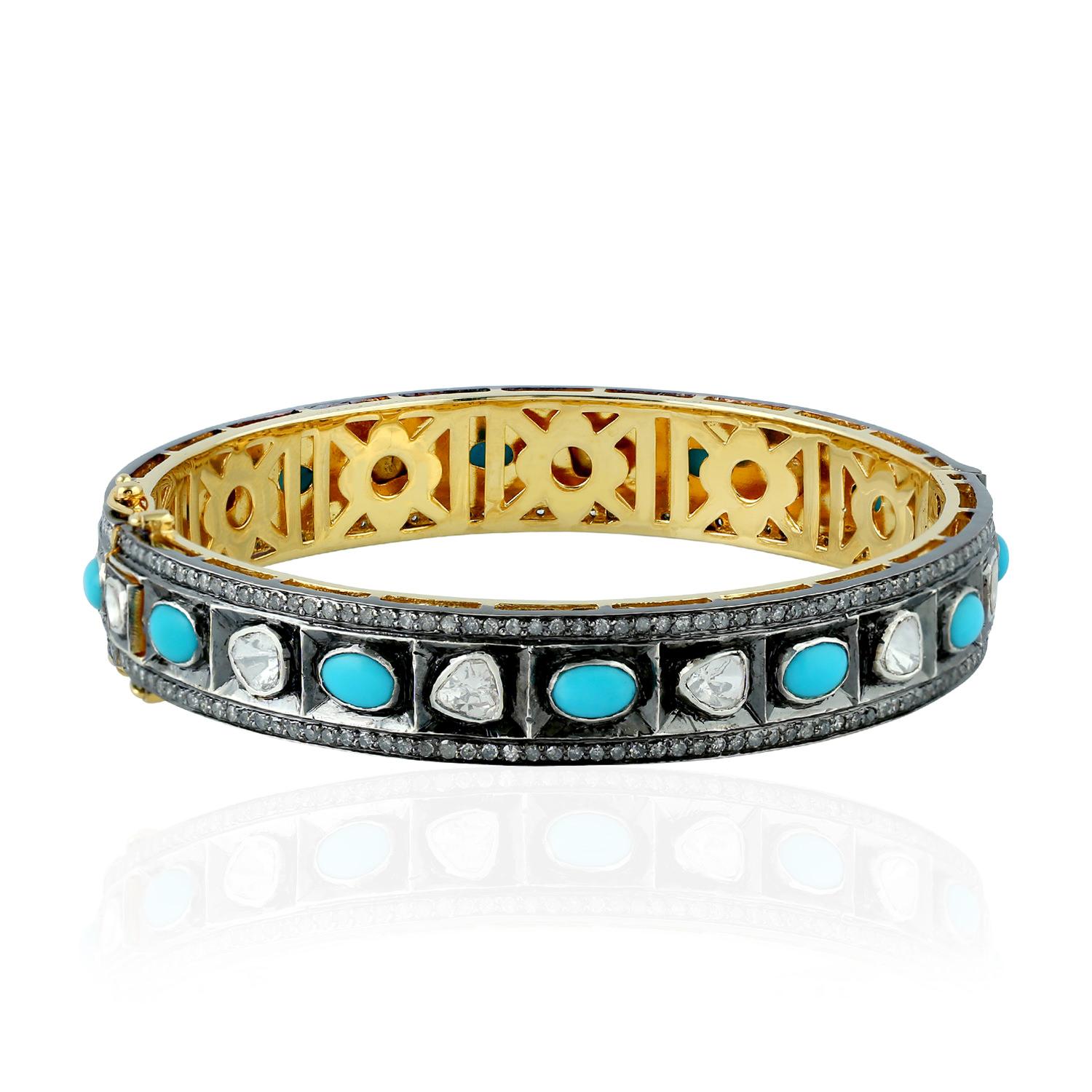 A stunning bracelet handmade in 18K gold & sterling silver with blackened finish. It is set in 3.62 carats turquoise & 2.62 carats rosecut diamonds. Clasp Closure

FOLLOW  MEGHNA JEWELS storefront to view the latest collection & exclusive pieces. 