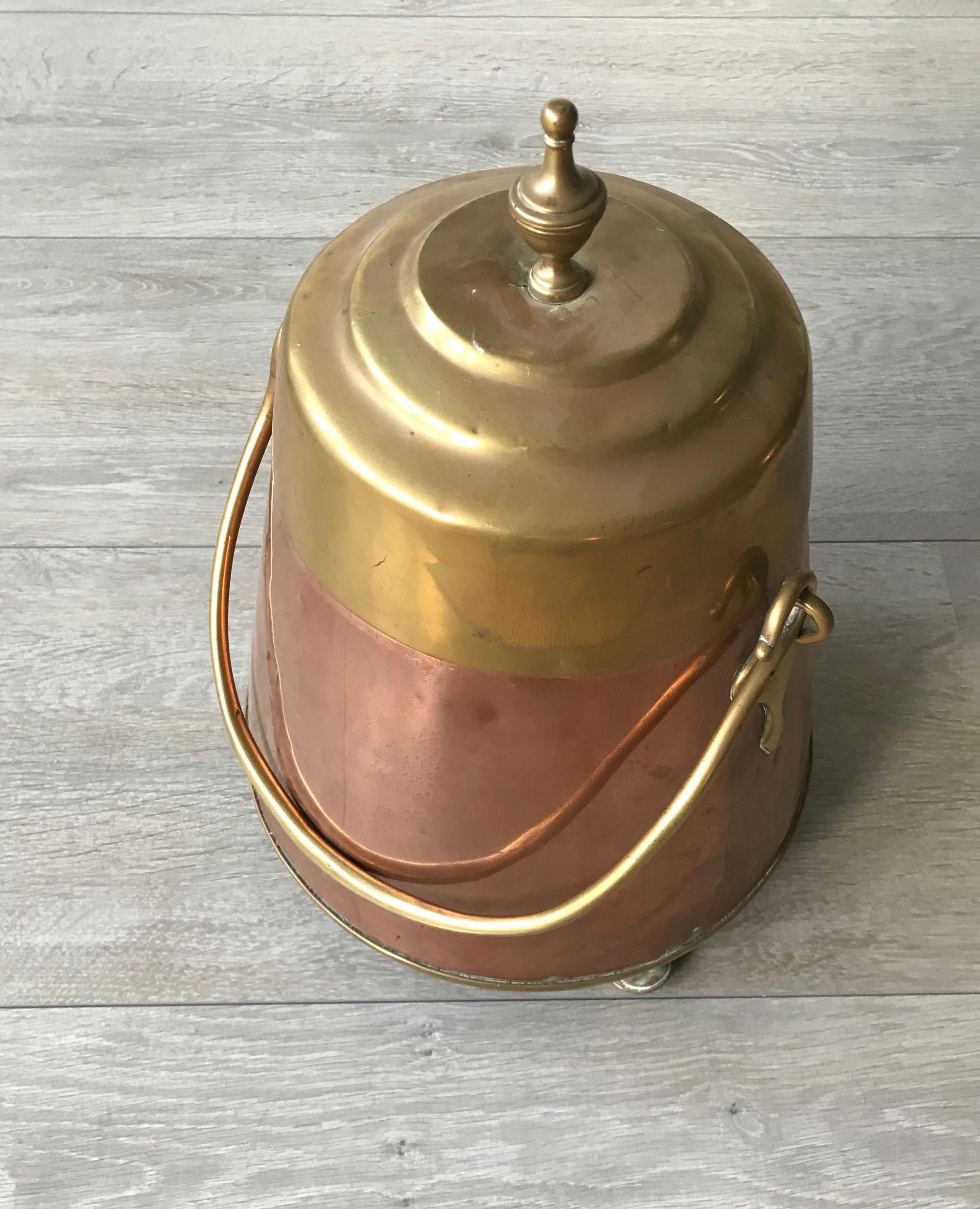 An elegant and very decorative copper fire place tool from the 1800s.

This handcrafted, copper and brass kettle could only be afforded by the very well-to-do in the 1800s in Europe and in the Netherlands in particular. It would have taken a highly