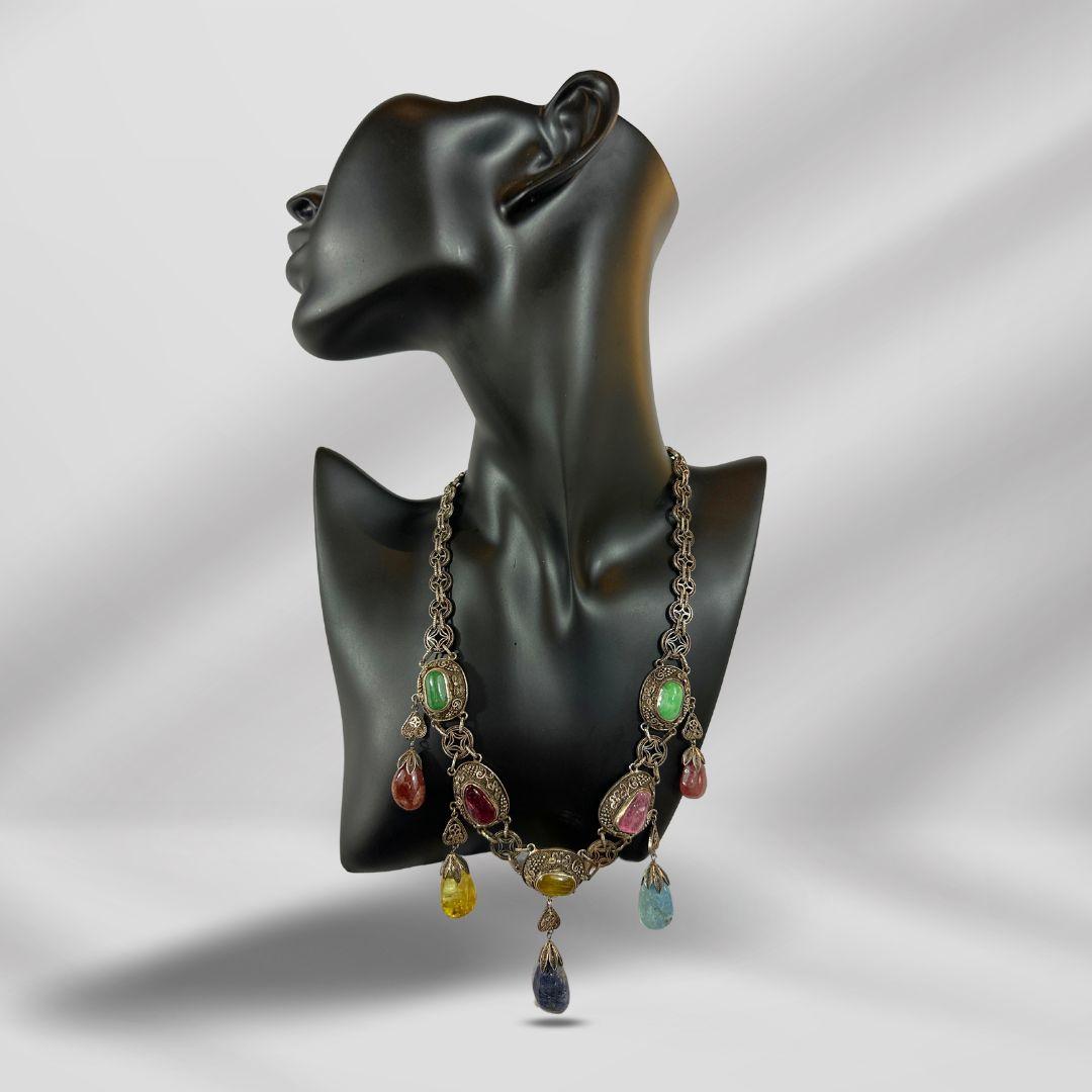 Bracelet Length: 17″

Bin Code:  N2 / P4

Step into a world of timeless beauty with our Antique Stylish Multi Drop Multi Gemstone Necklace. Crafted with vintage silver and adorned with ten stunning gemstones, this necklace is a true work of art that