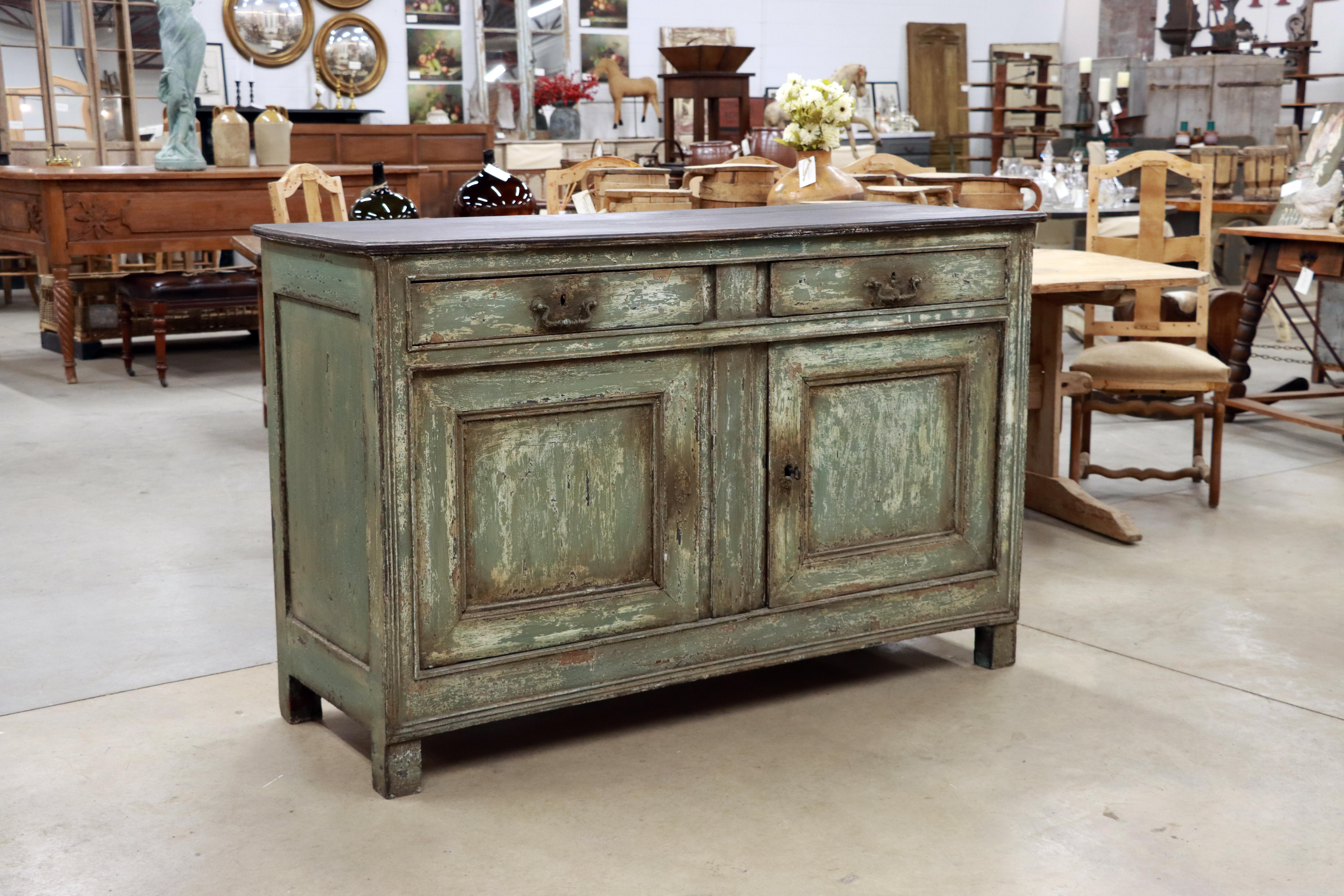 Substantial antique painted 2 door over 2 drawer oak buffet with silverware compartment.

Very beautiful green distressed painted finish with black top.

This lovely piece of furniture would work in many rooms including kitchen, dining room, living
