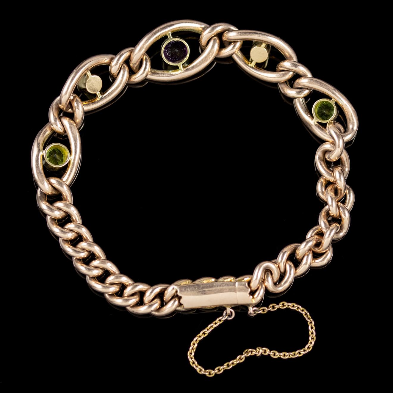 A lovely antique Suffragette chain link bracelet from the Victorian era featuring five large links adorned with Pearls, 0.25ct Peridots and a central 0.50ct Amethyst. 

Suffragette jewellery was worn to show one’s allegiance to the women’s