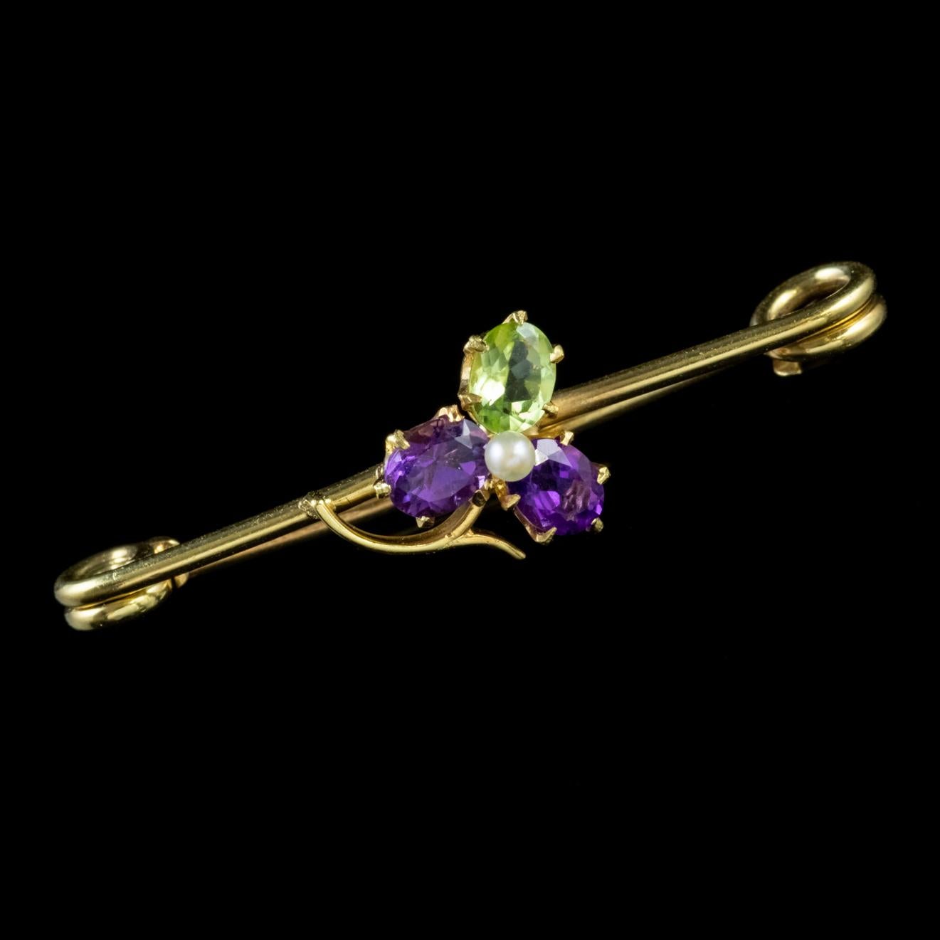 A wonderful antique Edwardian Suffragette brooch featuring a lucky three leaf clover decorated with Amethysts, a Peridot and Pearl. 

Suffragette jewellery was worn to show one’s allegiance to the women’s Suffragette movement in the early 20th