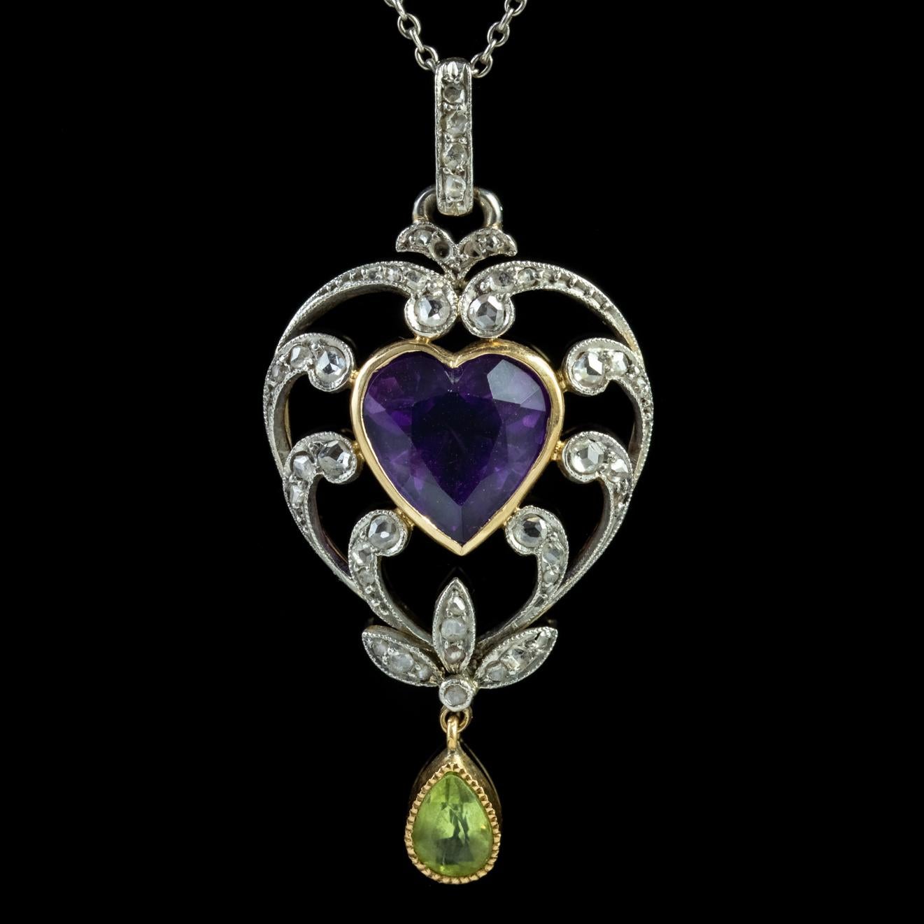A delightful antique Edwardian Suffragette necklace featuring a fabulous pendant decorated with sparkling Diamonds, a teardrop Peridot dropper and a lovely Amethyst heart in the centre which is approx. 3ct.

Suffragettes liked to be depicted as