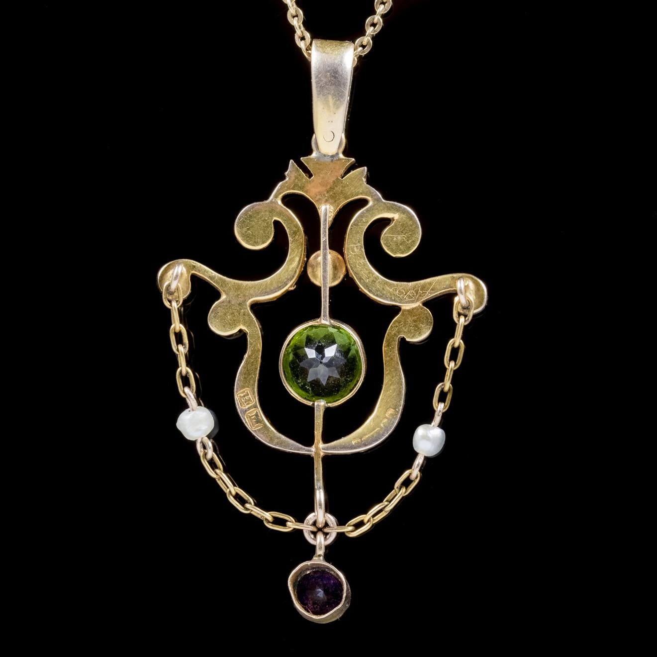 A wonderful antique Suffragette necklace featuring a fabulous pendant adorned with a green 0.75ct Peridot, a 0.20ct violet Amethyst dropper and decorated in lovely white Pearls. 

Suffragettes liked to be depicted as feminine, their jewellery