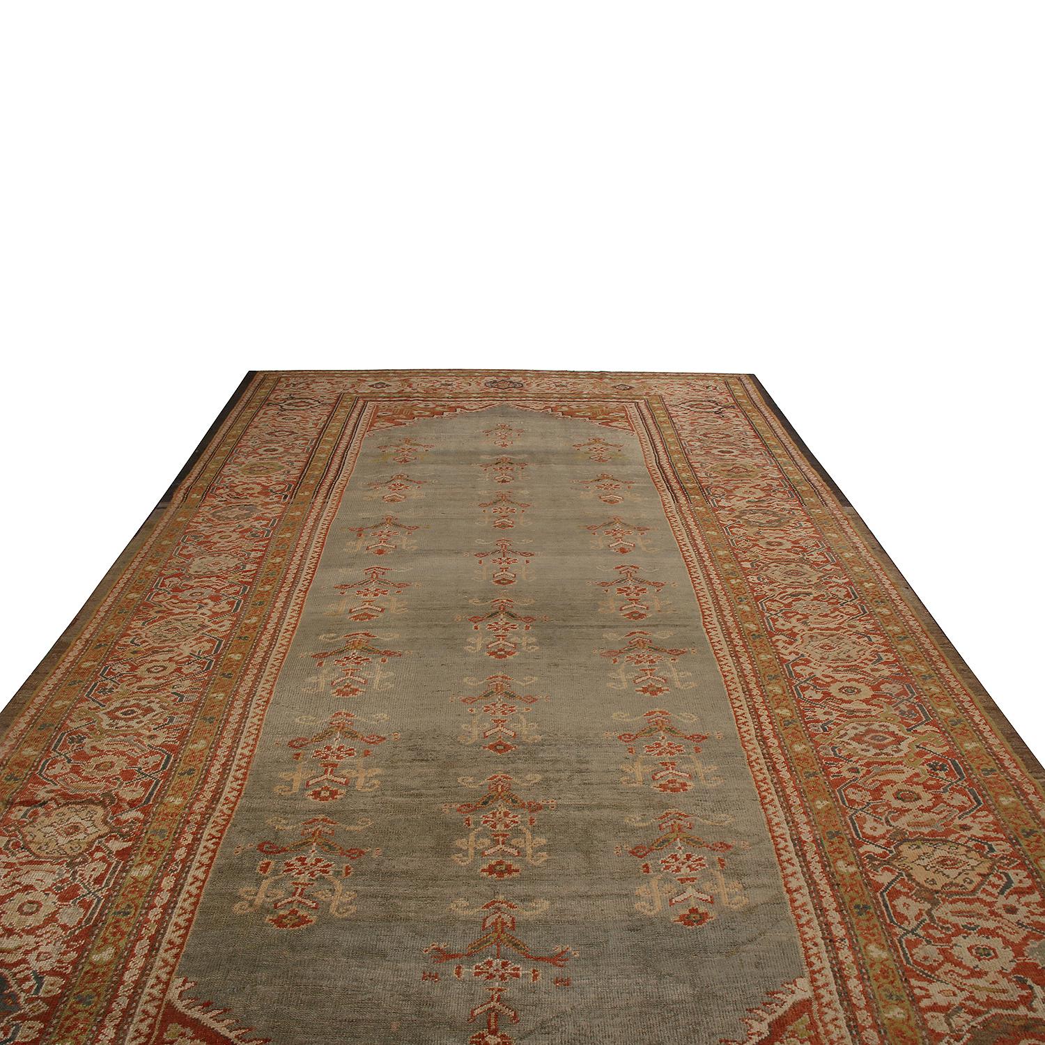 Hand knotted in Persia originating between 1880-1890, this antique Sultanabad Persian rug enjoys a rare abrashed blue background seldom seen in this design family, a bright contrast to the soft but intricate marriage of burgundy and golden-brown