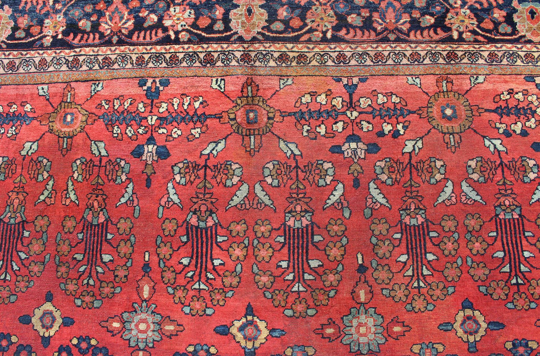 Wool Antique Sultanabad Carpet with All-Over Large Scale Flower Design With Red Field For Sale
