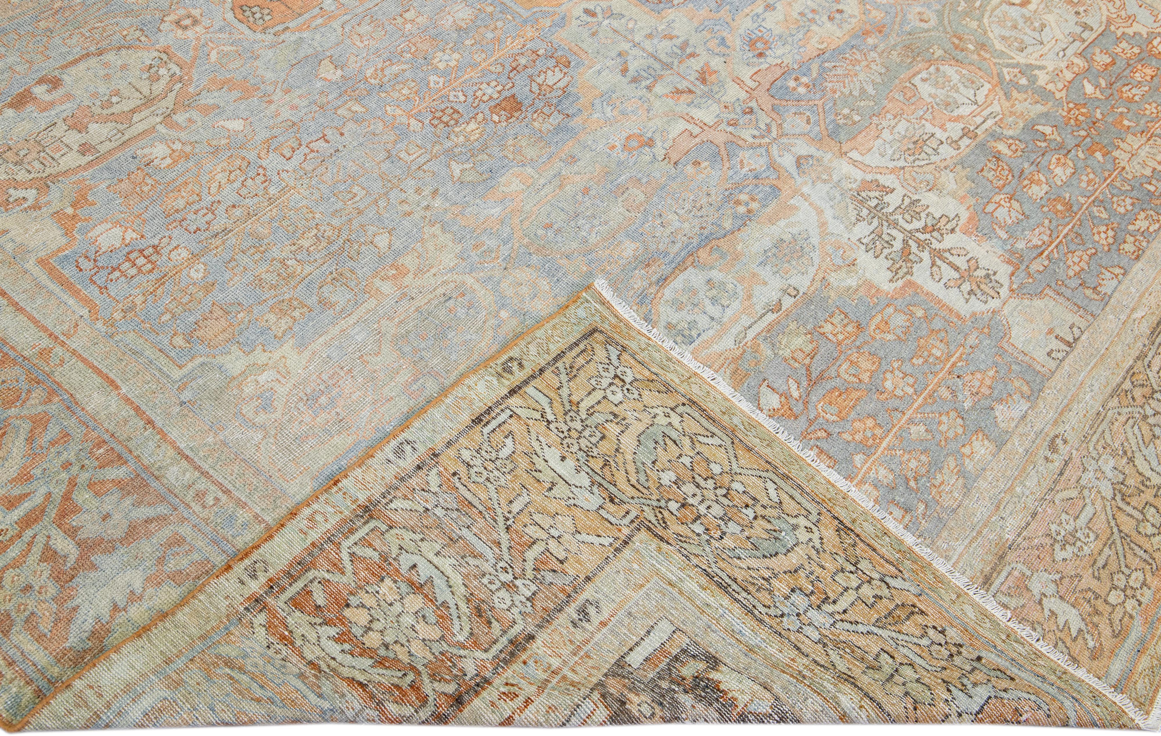 Beautiful antique Persian Sultanabad hand-knotted wool rug with a light blue field. This piece has a rusted designed frame and multicolor accents in a gorgeous all-over floral pattern design.

This rug measures: 8'7