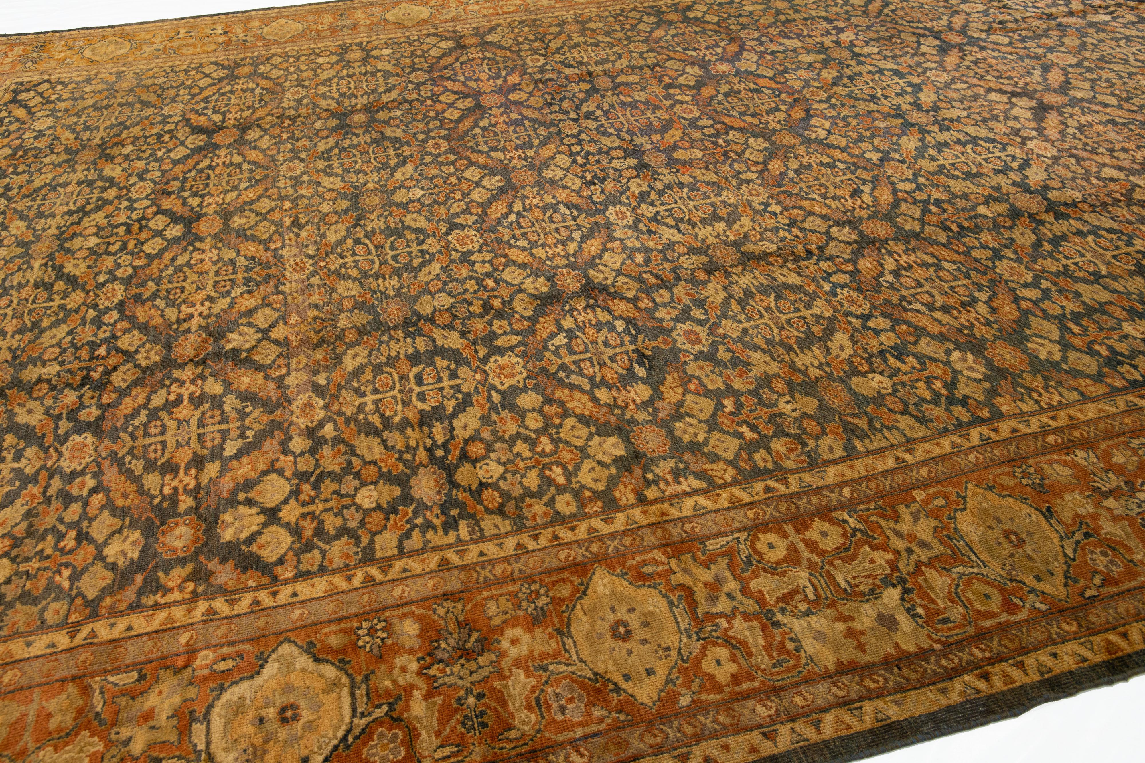 20th Century Antique Sultanabad Handmade Blue & Rust Wool Rug with Allover Floral Pattern For Sale