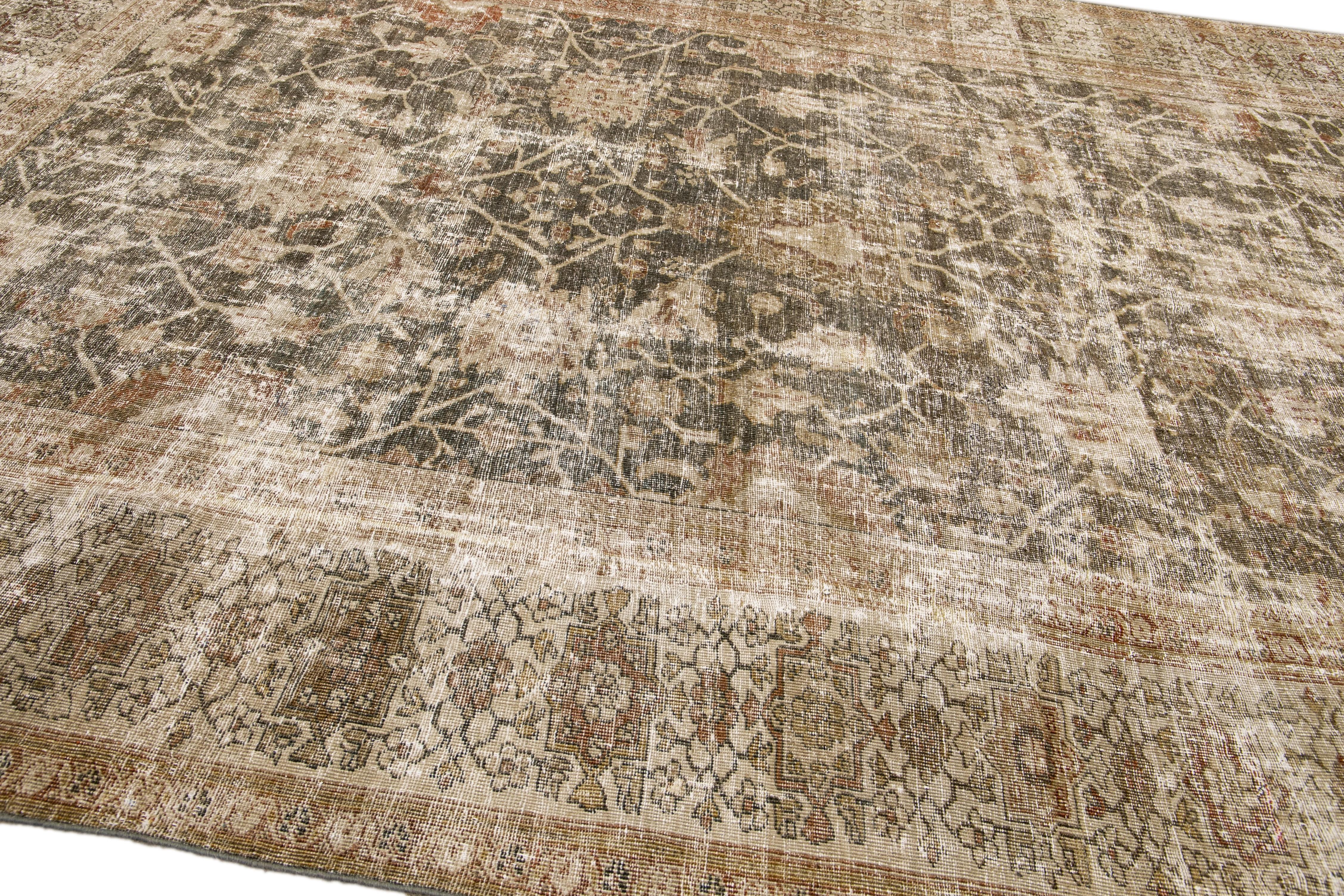20th Century Antique Sultanabad Handmade Floral Blue and Brown Distressed Wool Rug For Sale