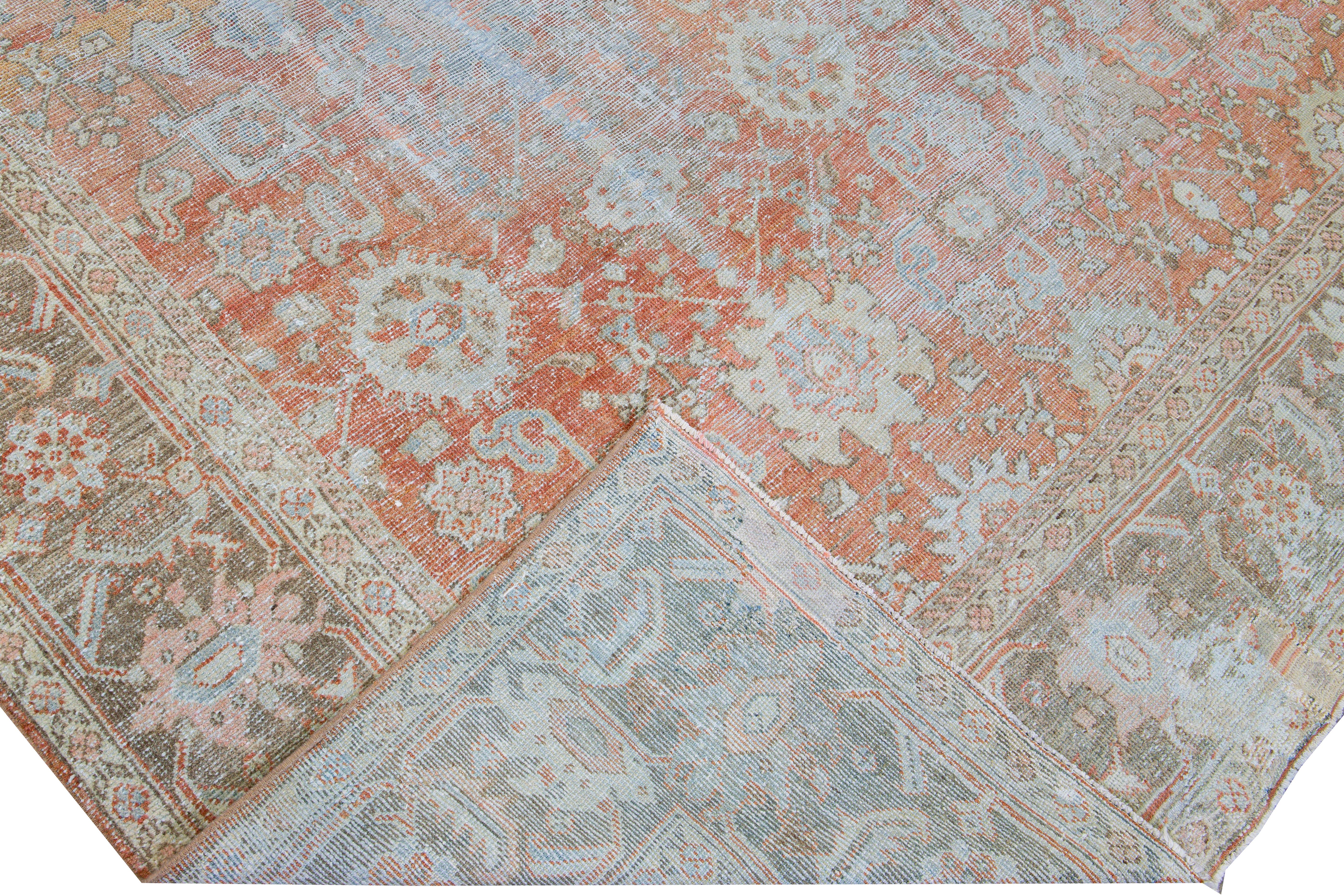 Beautiful antique Sultanabad hand-knotted wool rug with a red field. This sultanabad piece has a blue frame and ivory accents in a gorgeous all-over floral pattern design.

This rug measures: 9' x 12'.

Our rugs are professional cleaning before