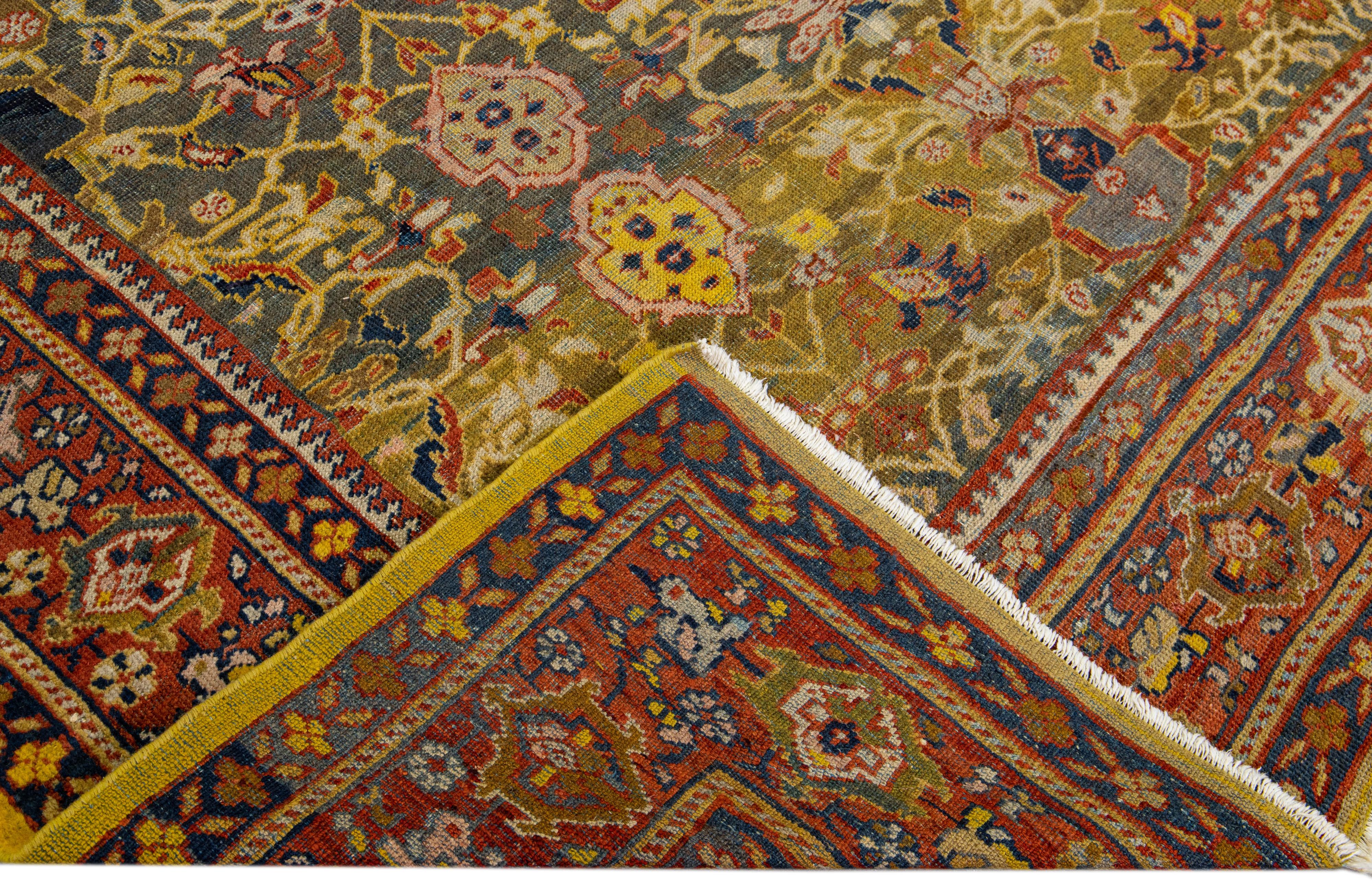 Beautiful antique Persian Sultanabad hand-knotted wool rug with a gray field. This piece has a rusted designed frame and yellow and brown accents in a gorgeous all-over floral pattern design.

This rug measures: 8'7