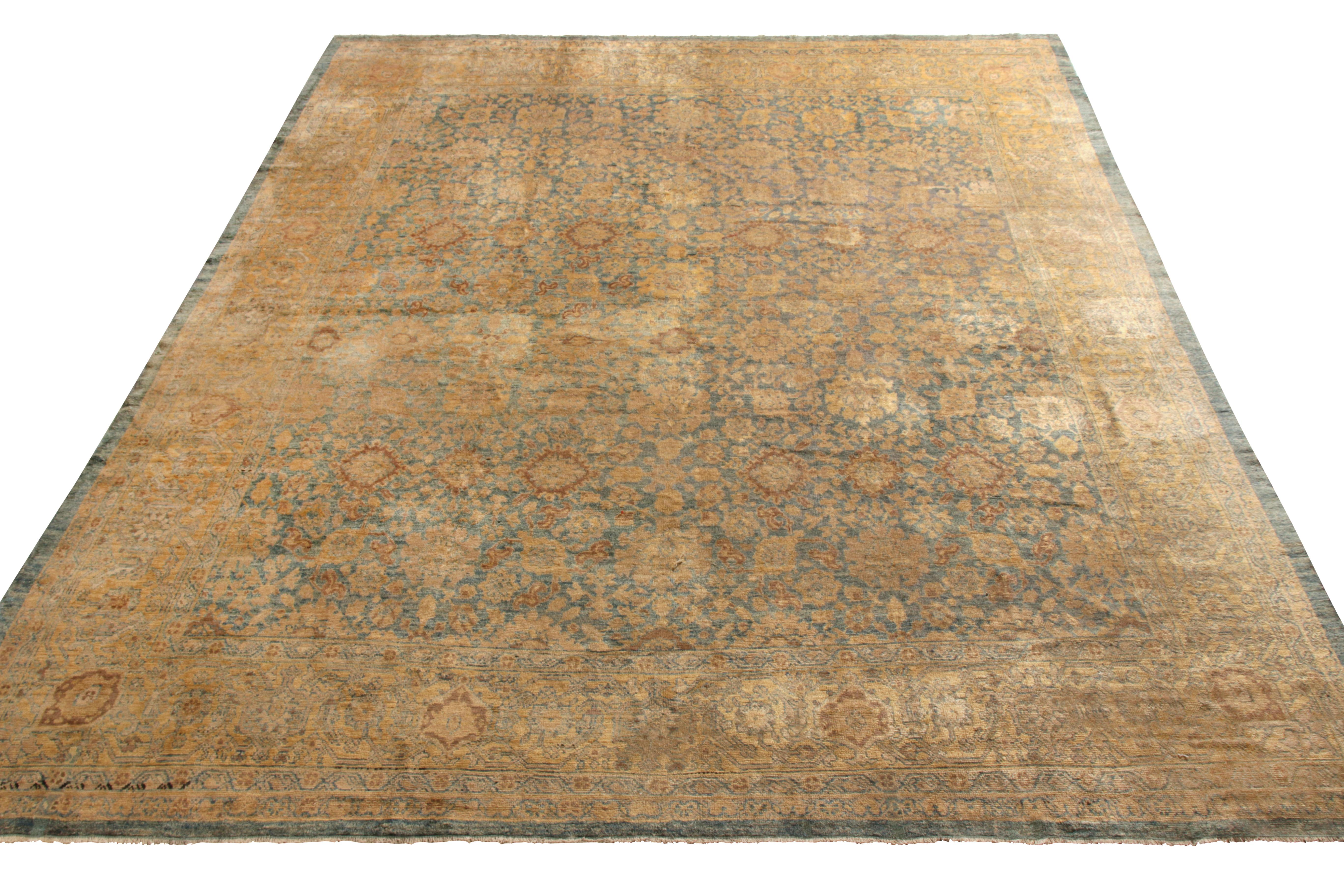 Hand knotted in wool circa 1920-1930 and teeming with rustic charm, this antique 10x12 Sultanabad rug is an exemplary descendant of this famed Persian rug lineage. The plush persona of the rug enjoys an intricate all over floral pattern in