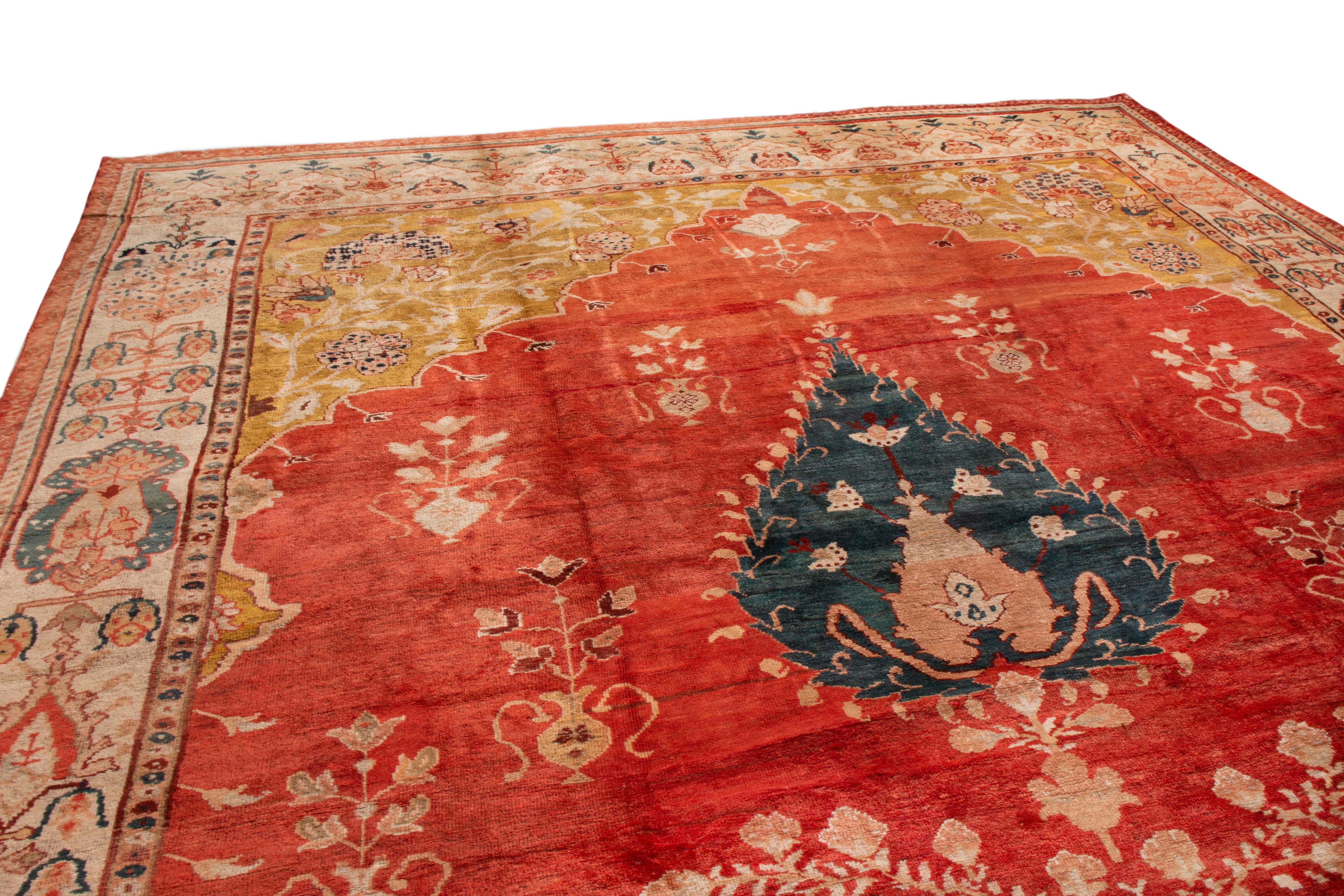 This antique Sultanabad rug has an uncommon field orientation for a Persian rug. From 1890-1900, its well-drawn graph was designed with only vertical symmetry, whereas many Sultanabad rugs typically had both vertical and horizontal orientation. Both
