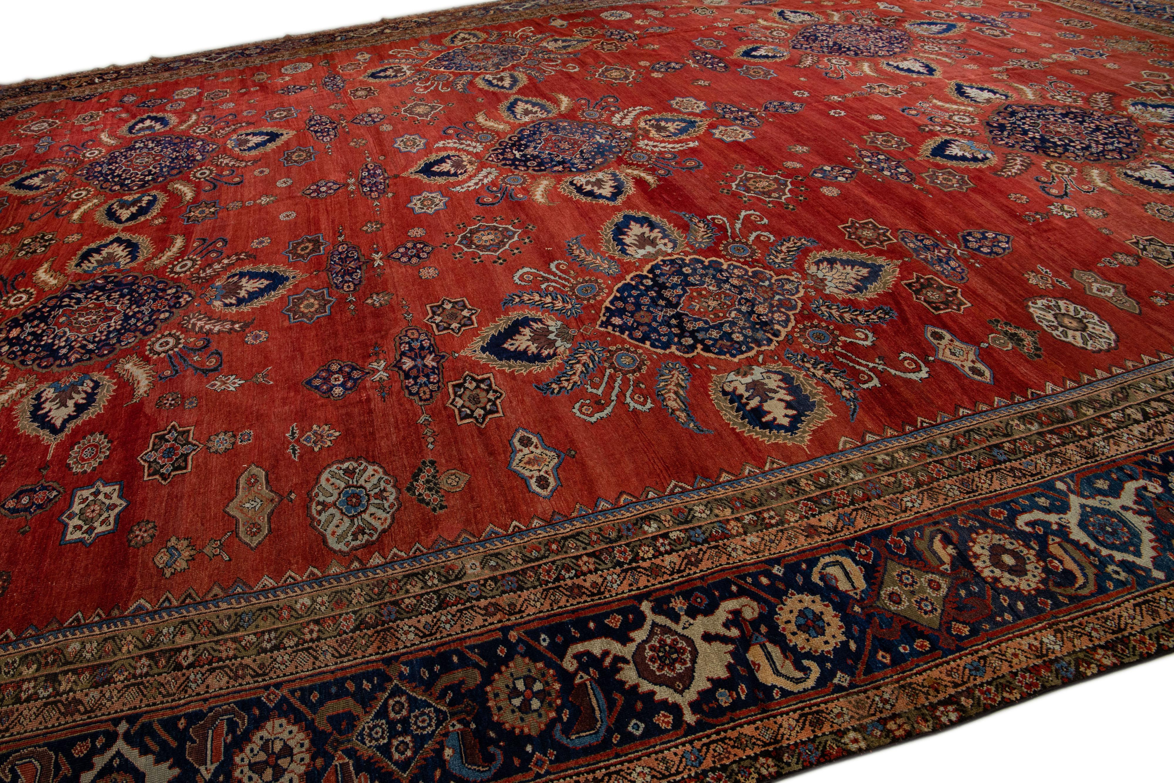 Noué à la main Tapis ancien en laine persane Sultanabad rouge à motifs floraux faits à la main en vente