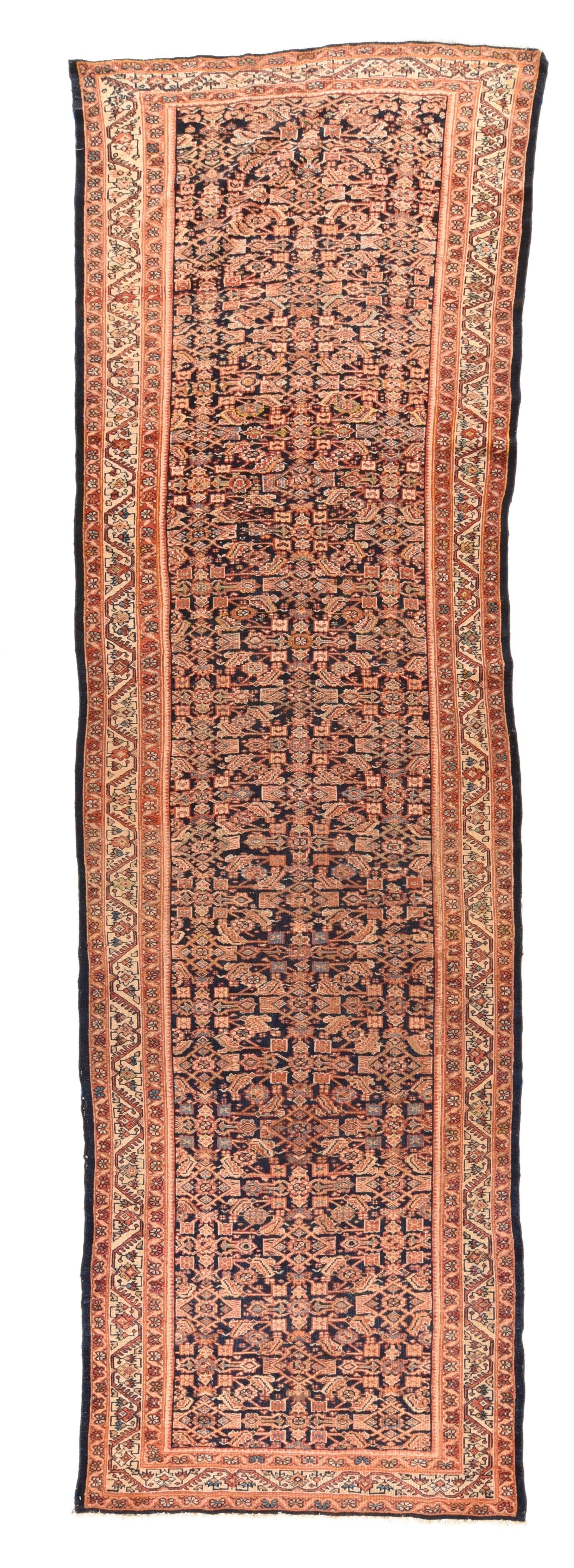 Antique Sultanabad Rug 4'1'' x 13'2''. This wide, west Persian village Kenare (runner) shows a dark navy blue field in a Herati design with a decided central vertical axis. The cream main border presents rosette/palmettes developing from a fringed